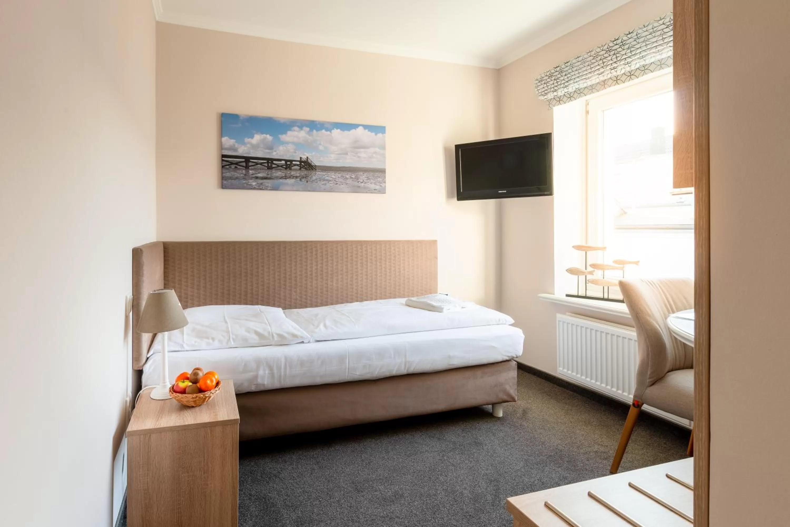 Photo of the whole room, Bed in Nordsee-Hotel Hinrichsen