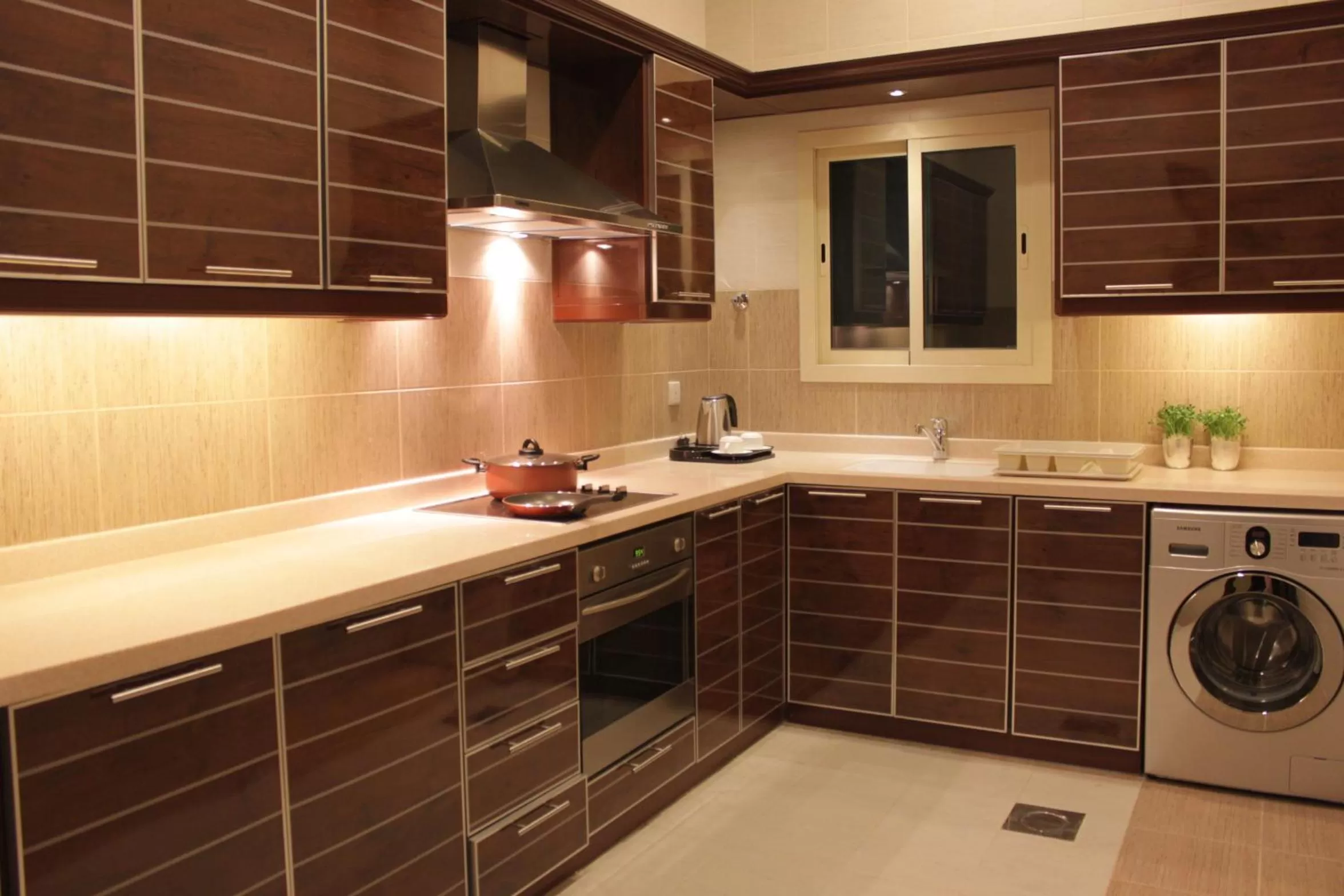 Kitchen or kitchenette in Mandarin Alshamal Hotel Apartments