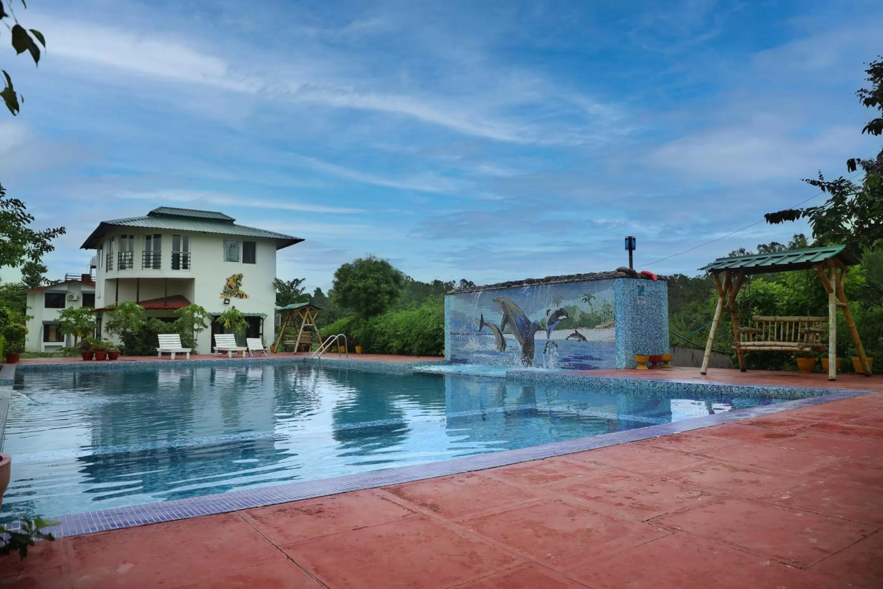Swimming pool in Corbett Treat Resort By Atya Hotels
