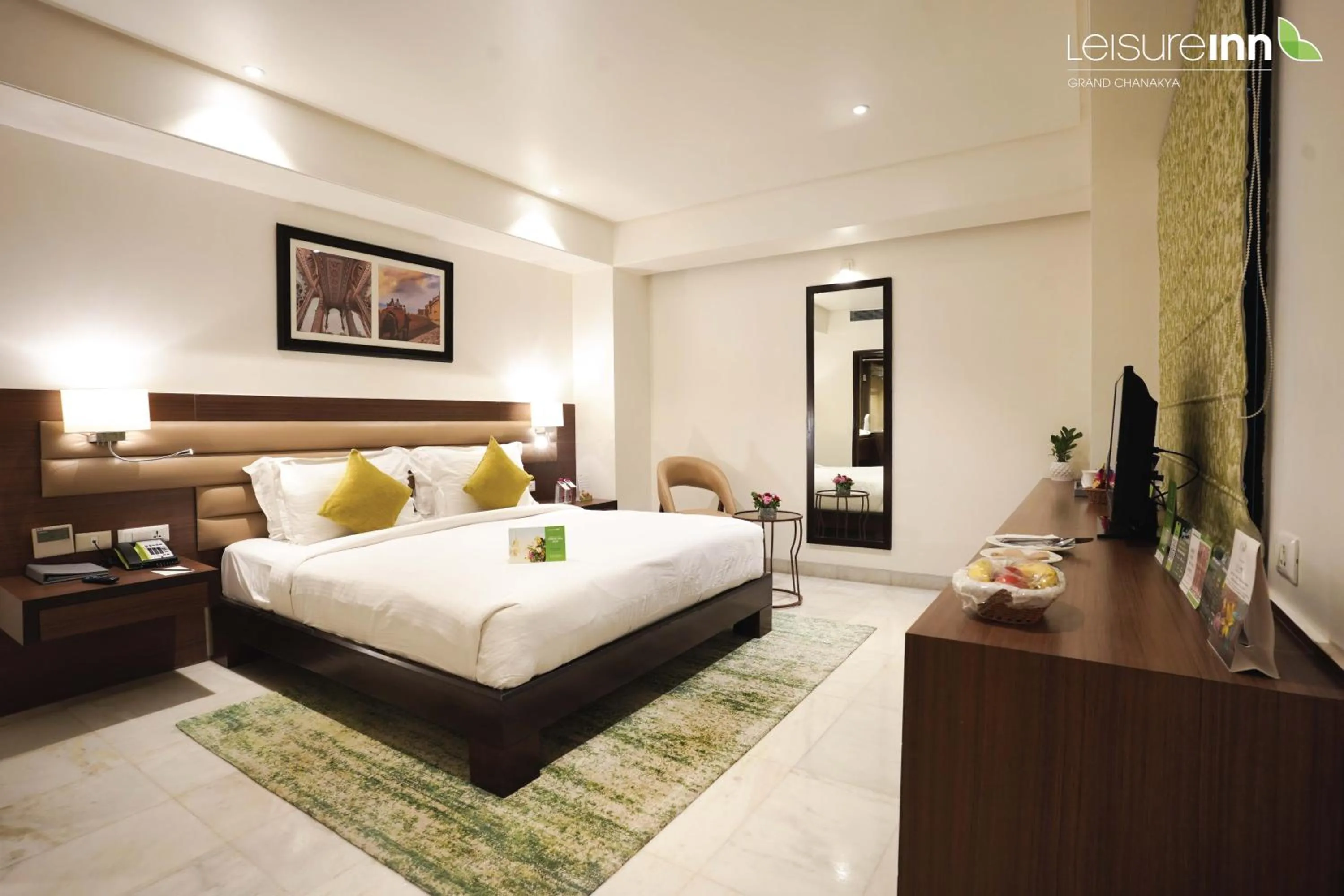 Photo of the whole room, Bed in Leisure Inn Grand Chanakya