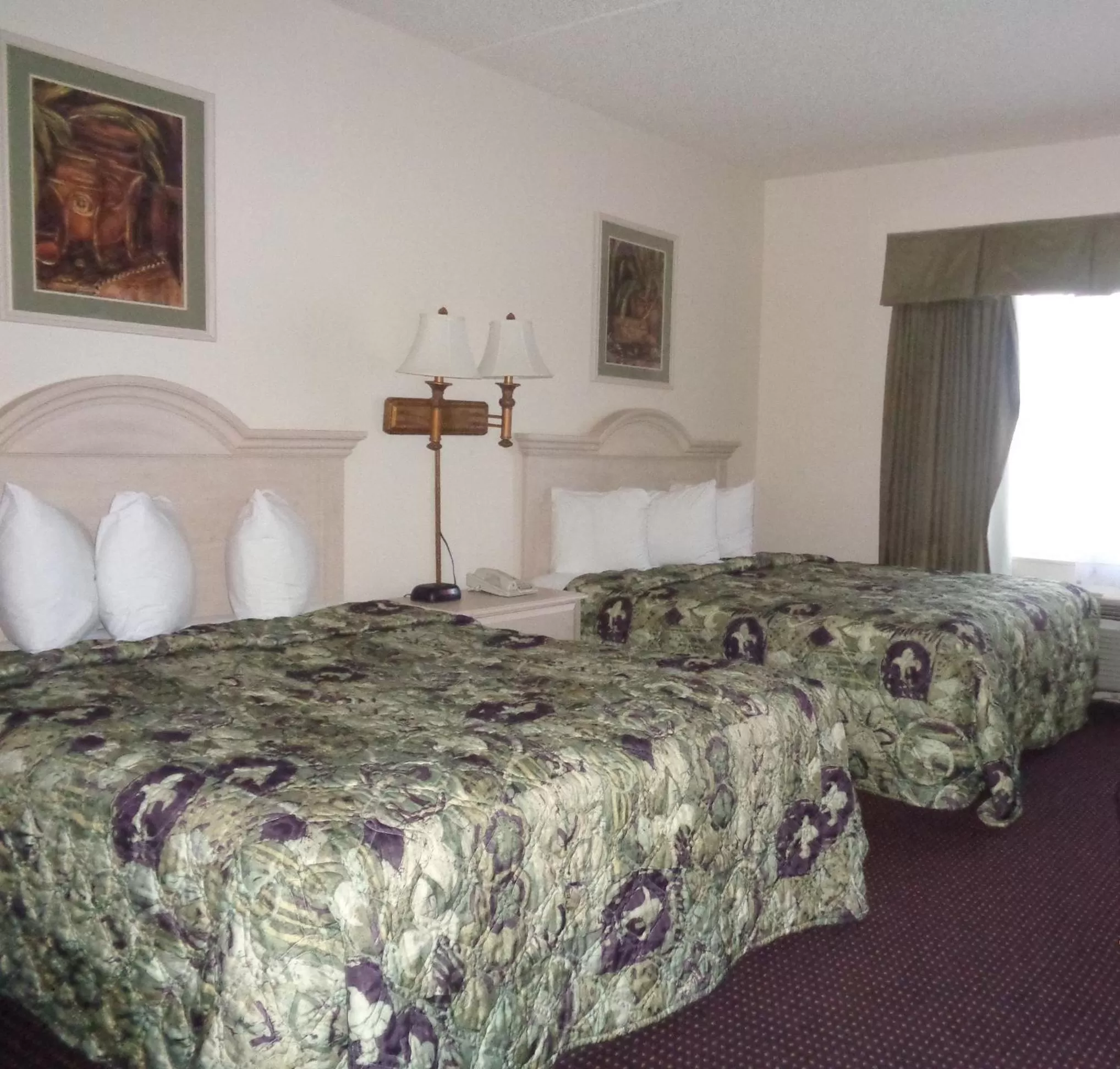 Bed in Allure Suites of Fort Myers