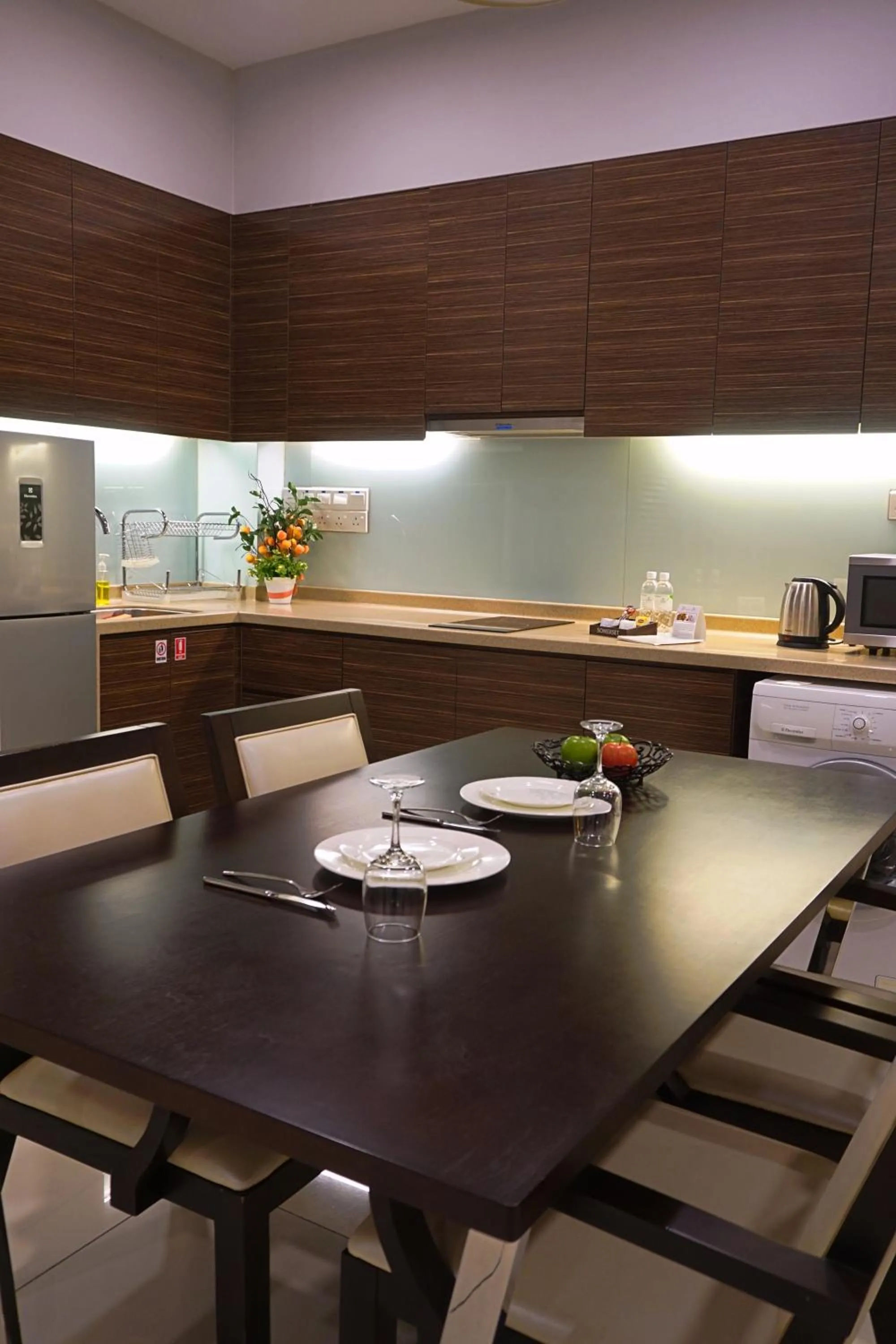 Communal kitchen in Trinidad Suites Johor, Trademark Collection by Wyndham