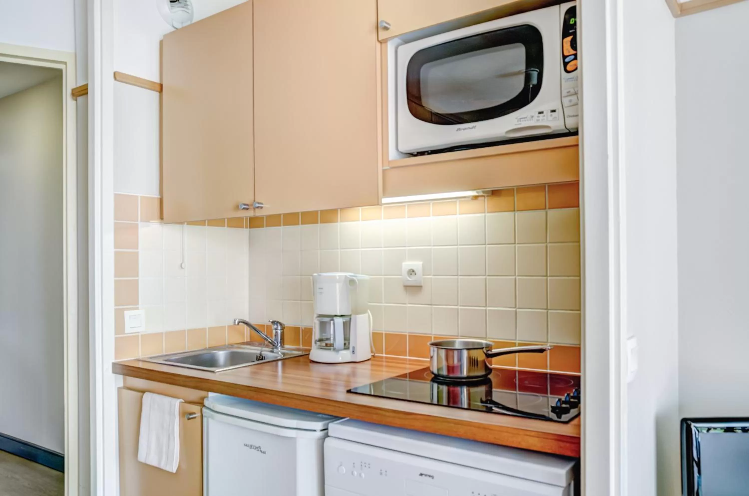 Kitchen or kitchenette in Pierre & Vacances Le Moulin des Cordeliers