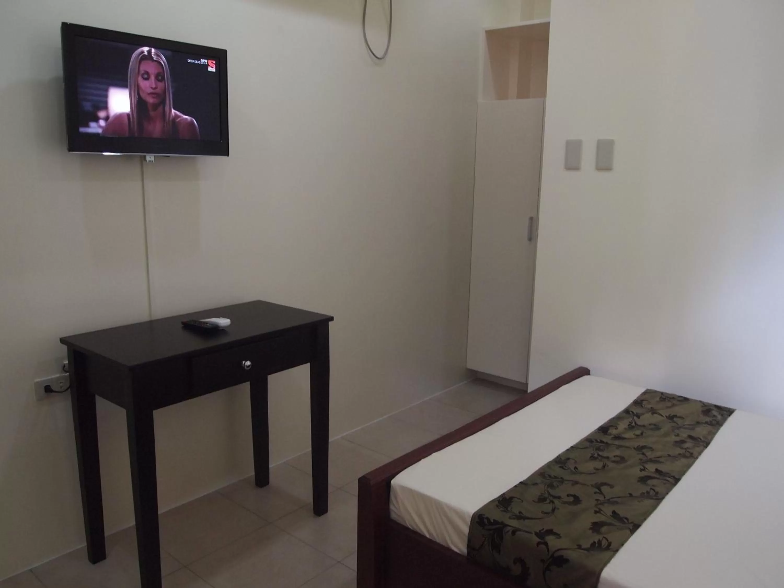 Bed in Blue Lagoon Inn & Suites