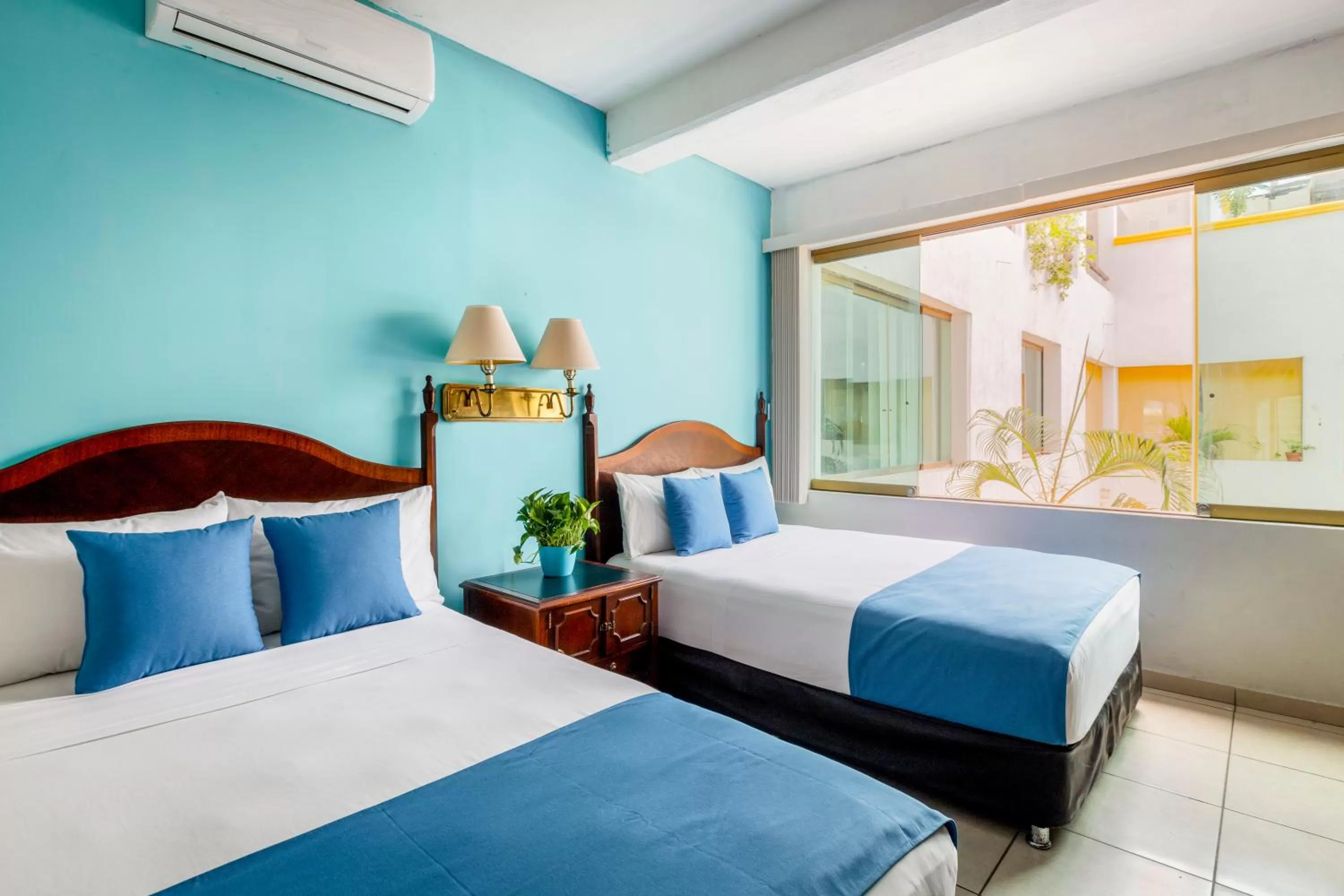 Bed in Hotel Pueblito Vallarta