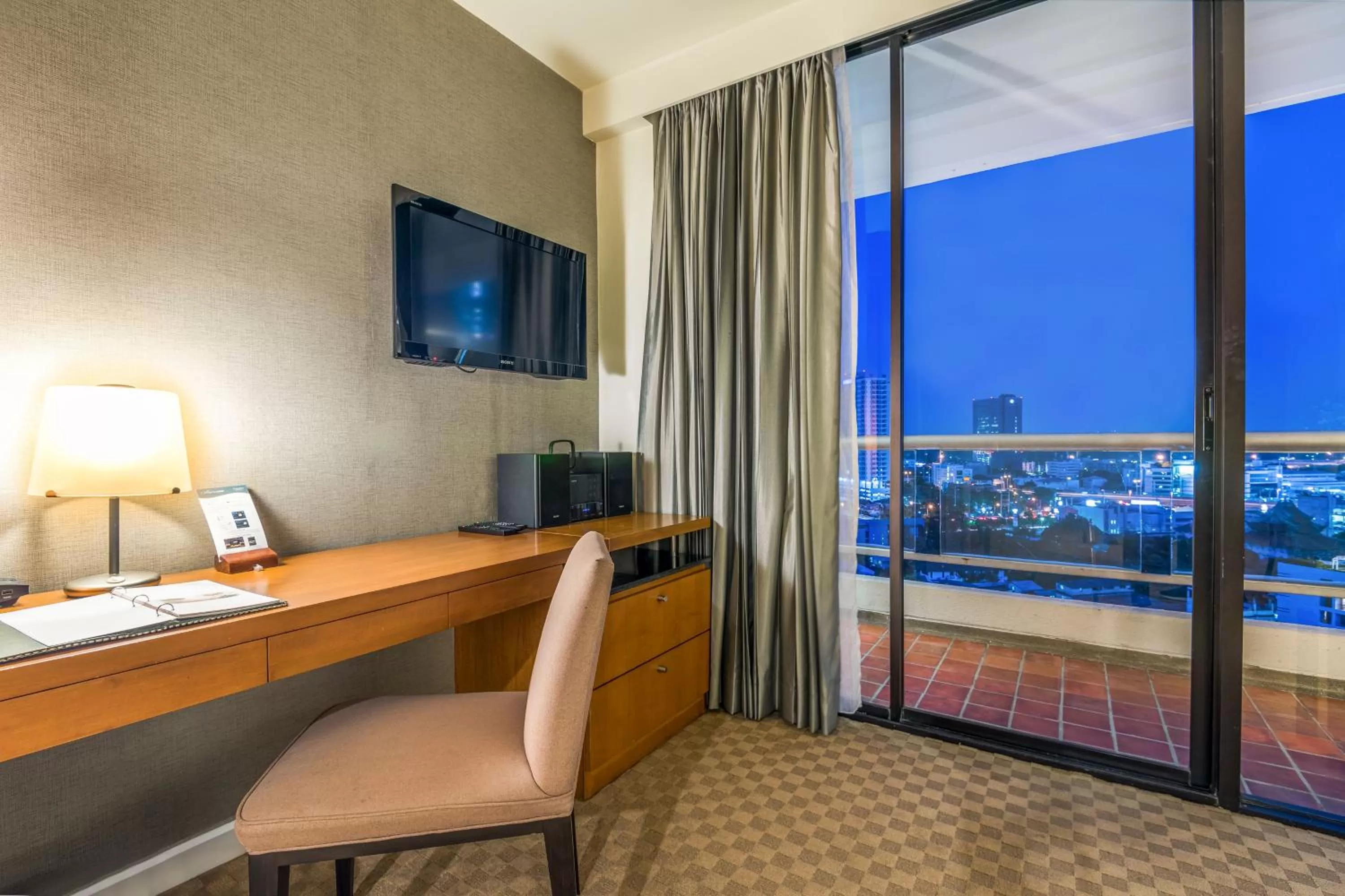 Communal lounge/ TV room in Chatrium Sathon Bangkok