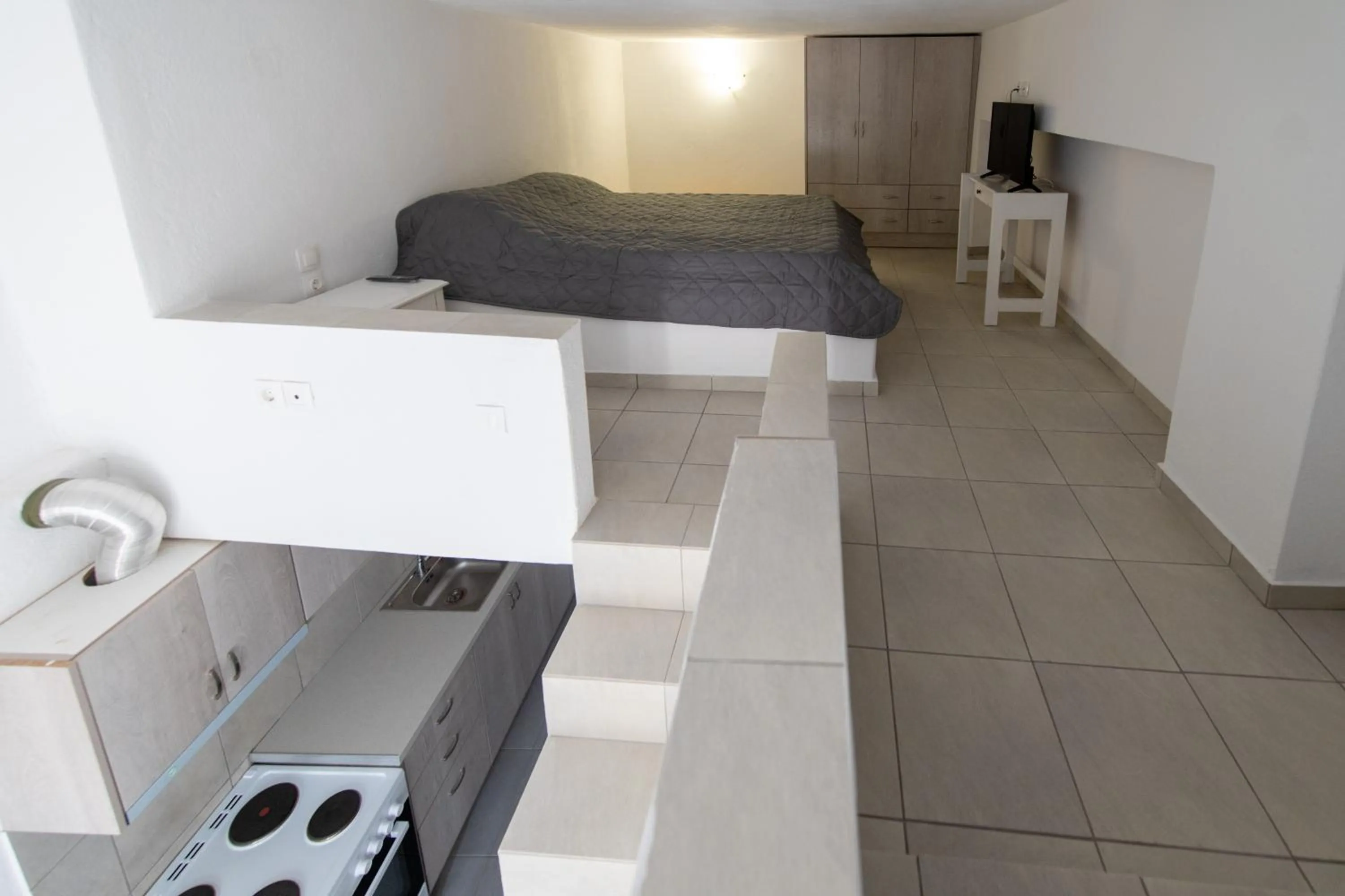 Communal kitchen, Bed in Porto Castello