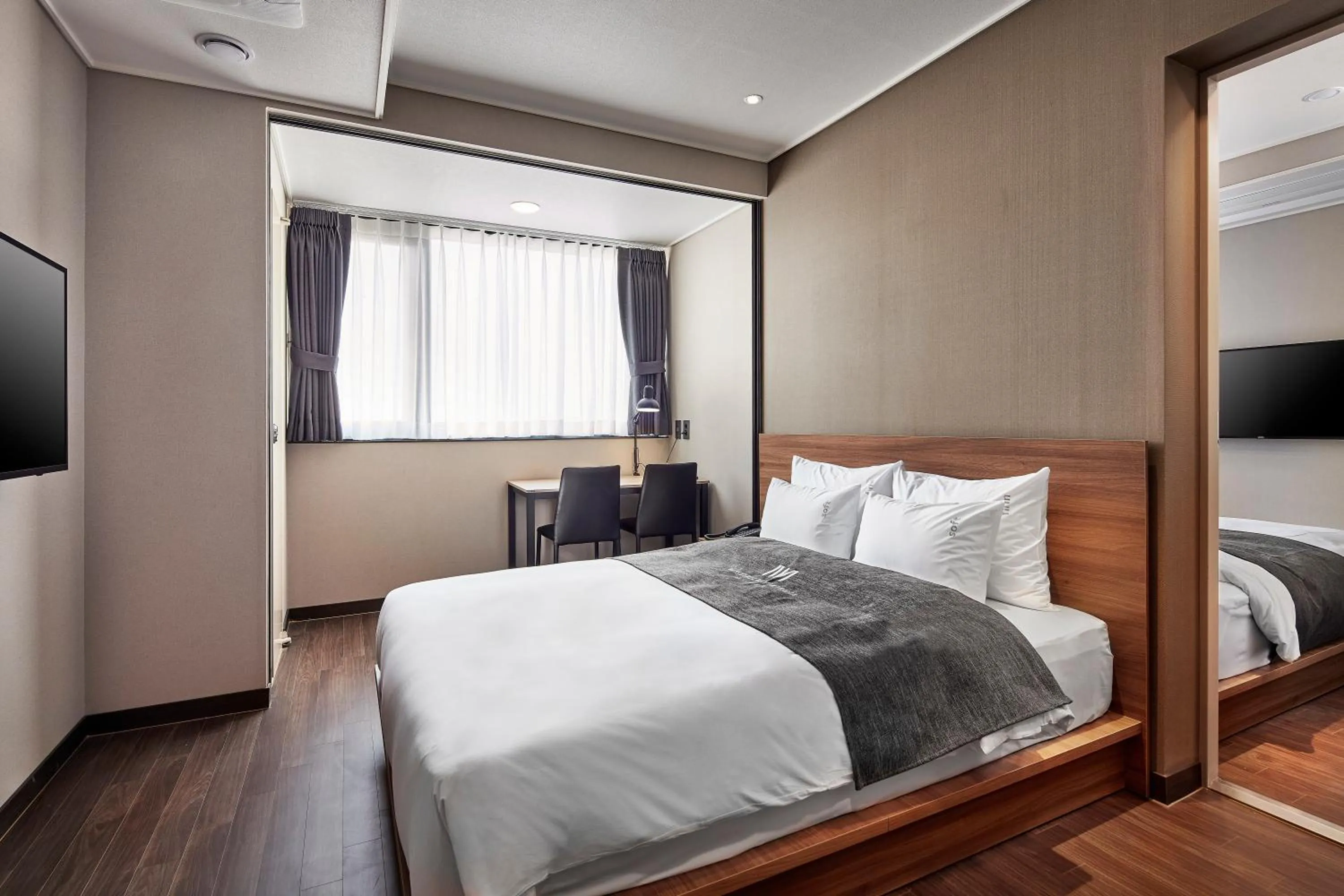 Bed in Western Bay Marina Hotel