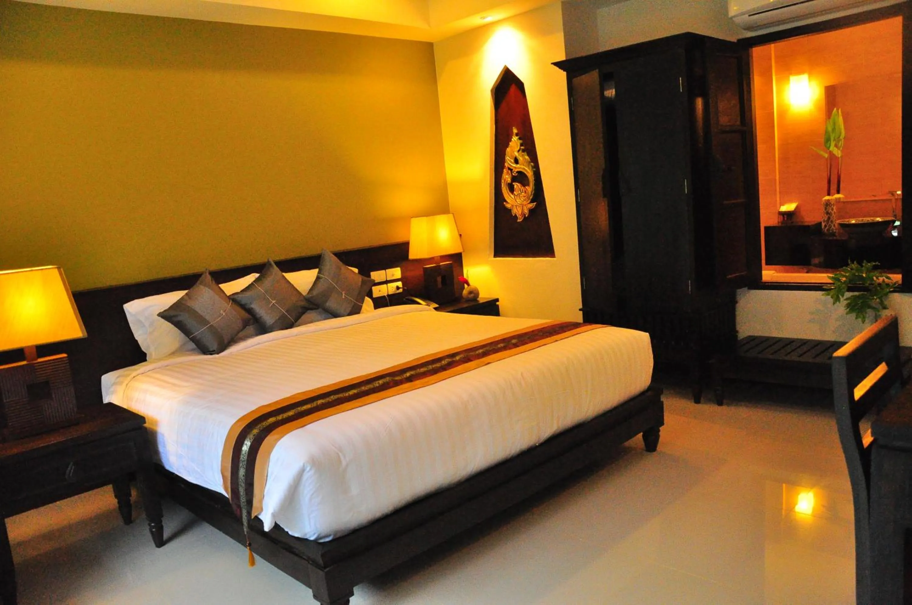 Bed in Navatara Phuket Resort