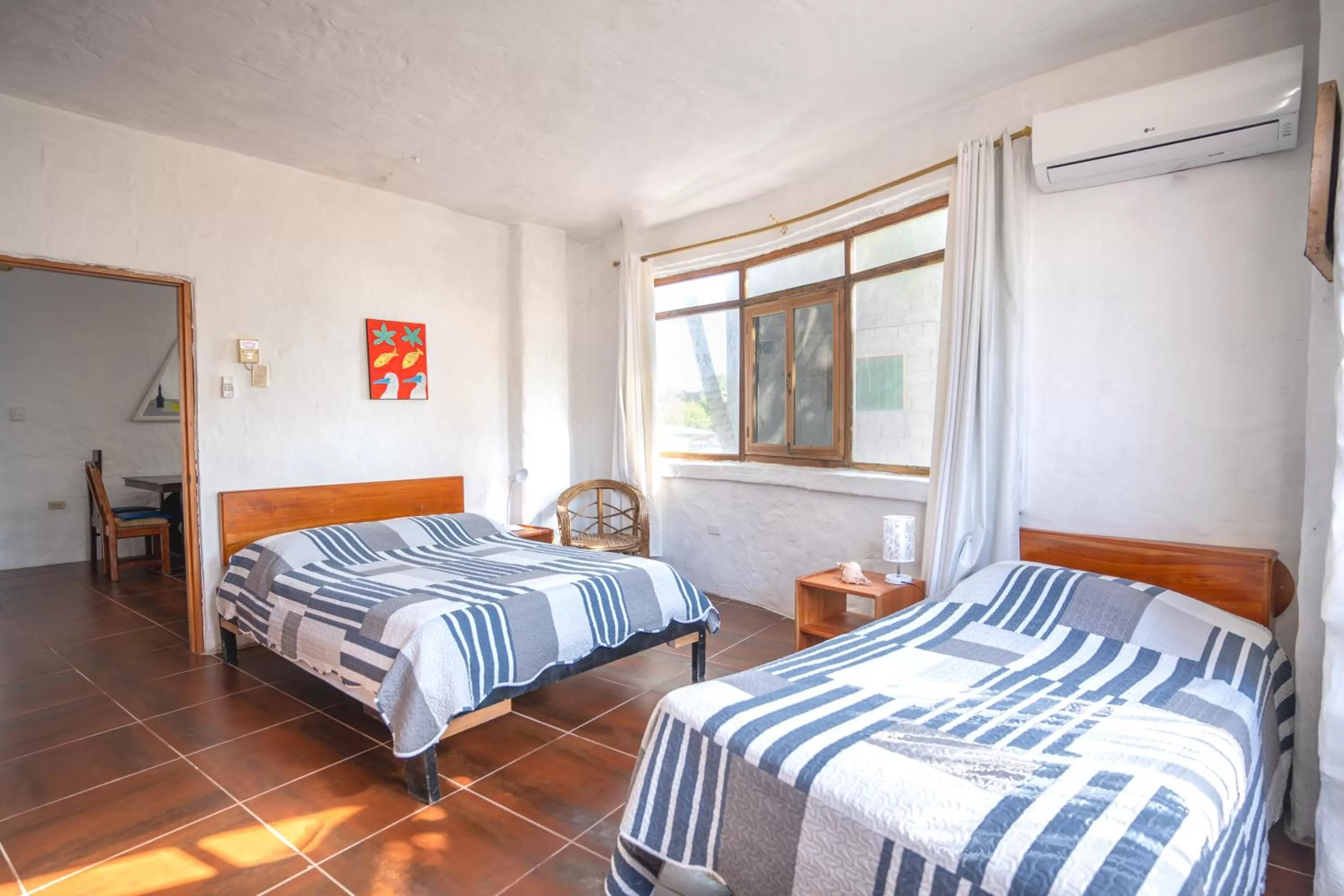 Bed in Hostal Galapagos by Bar de Beto