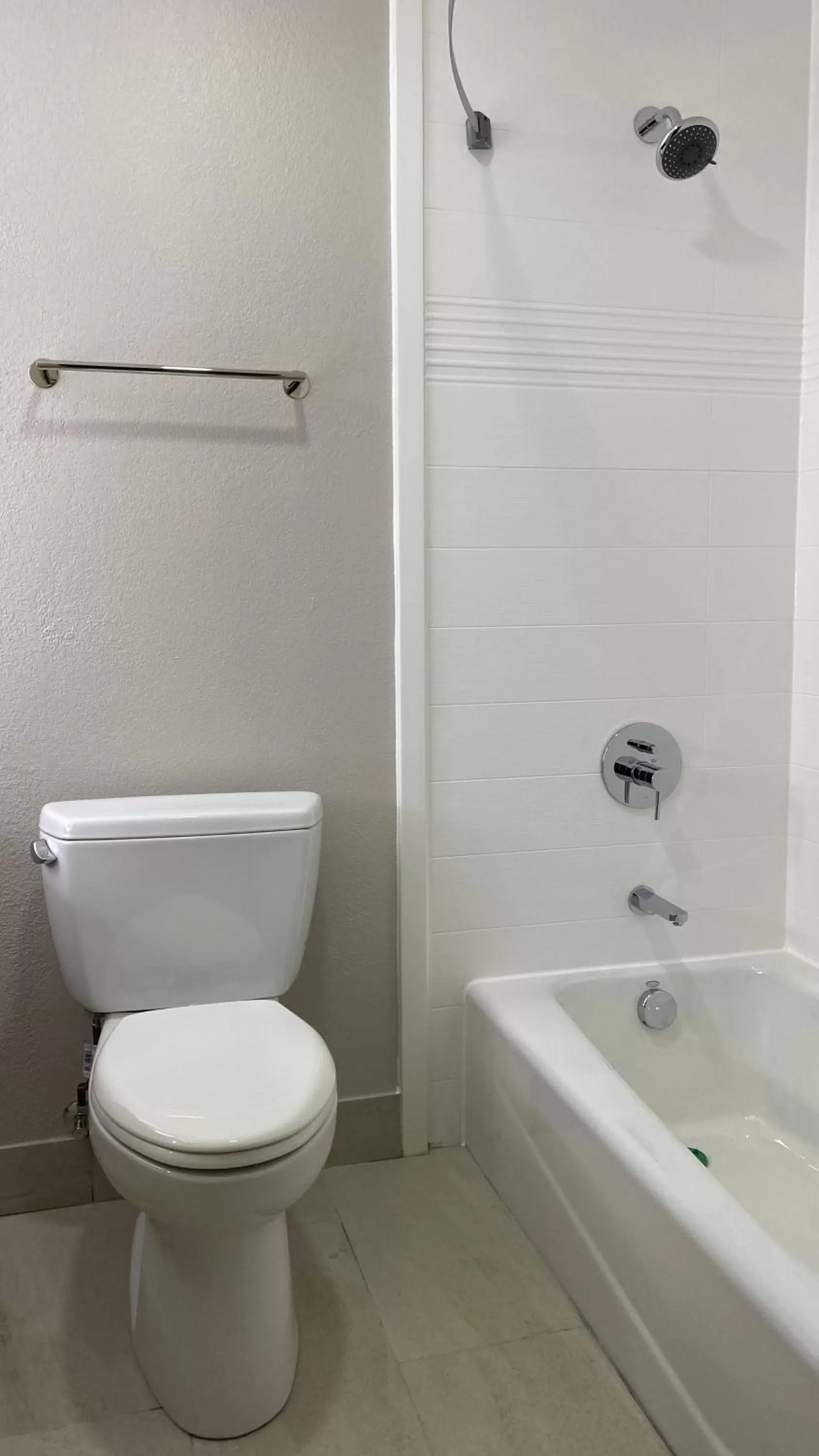 Toilet in Days Inn & Suites by Wyndham Peachtree Corners Norcross