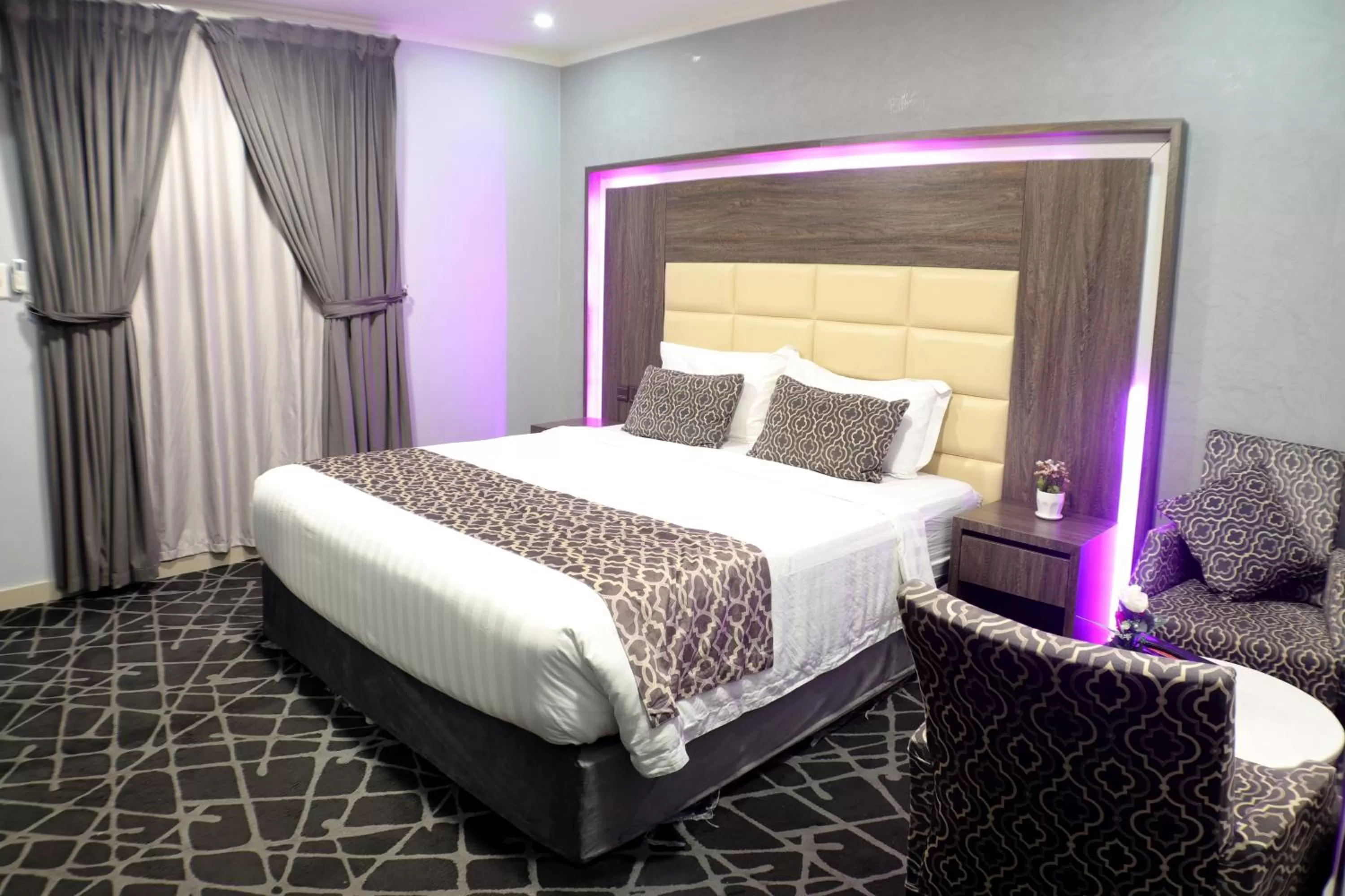 Bed in Maskan Al Dyafah Hotel Apartments