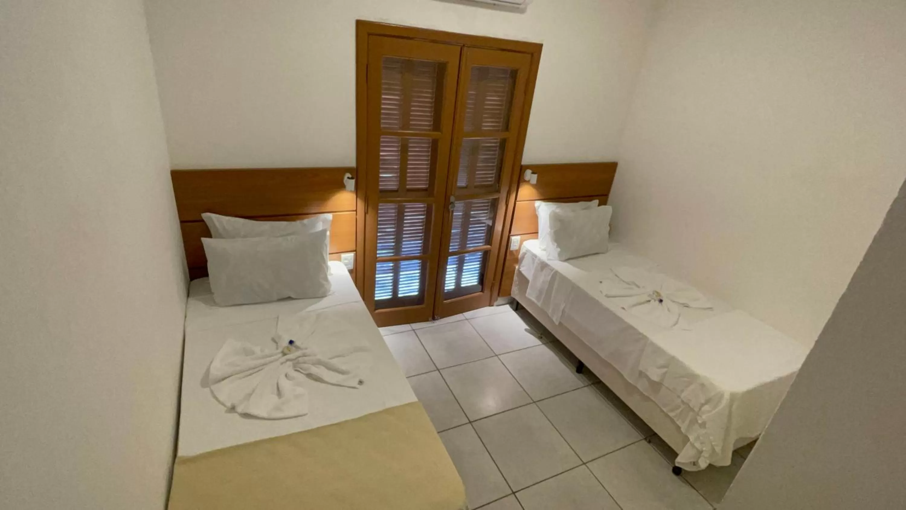 Bed in Pousada Ilha Vitoria