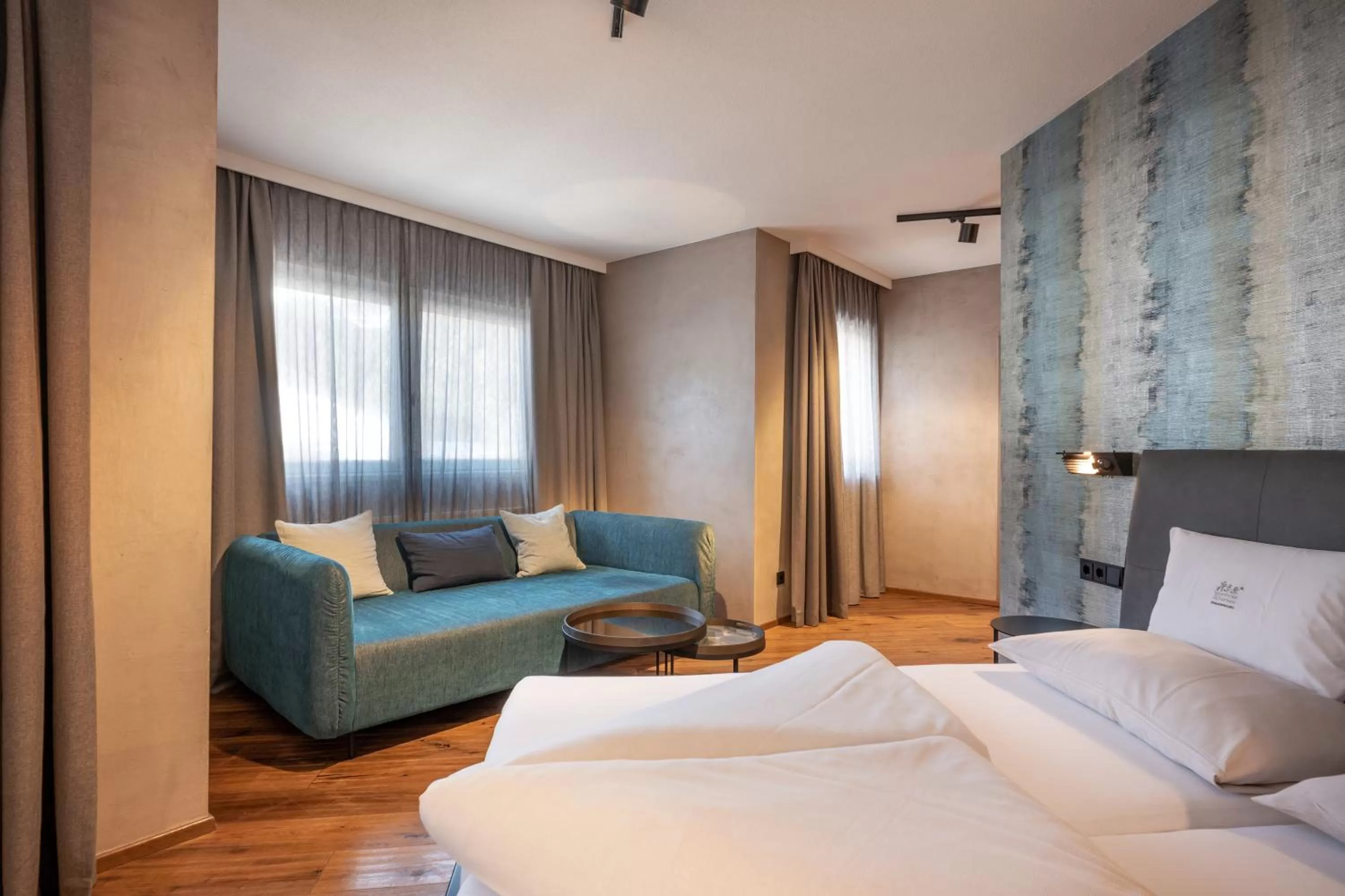 Living room, Bed in Familienparadies Sporthotel Achensee - FAMILIES ONLY