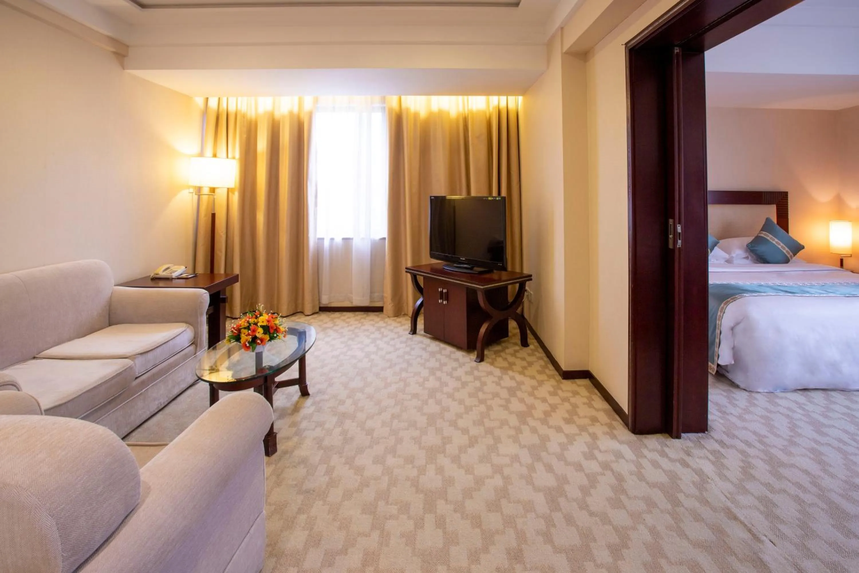 Living room, Bed in Guangdong Victory Hotel