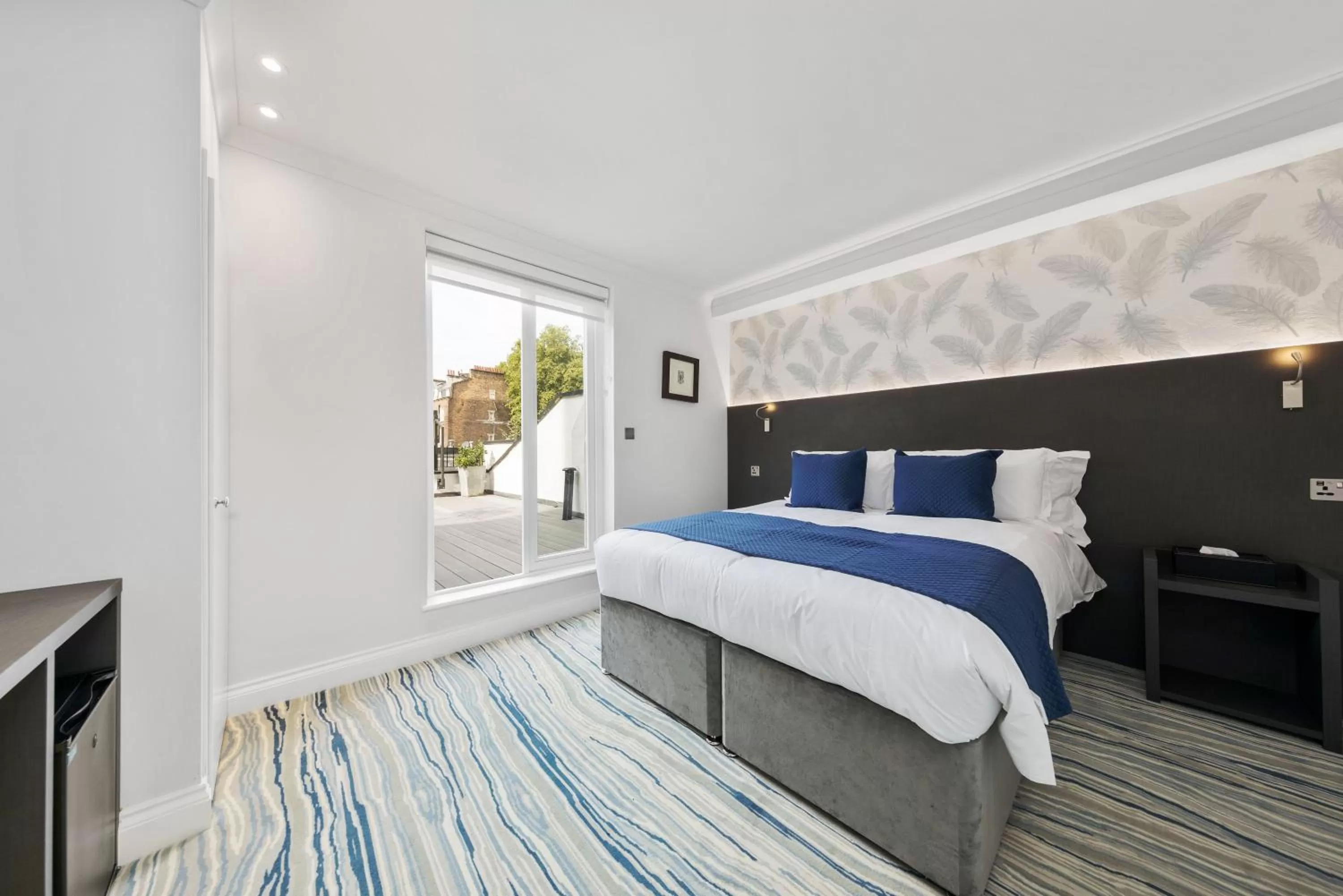 Bed in Commodore Hotel