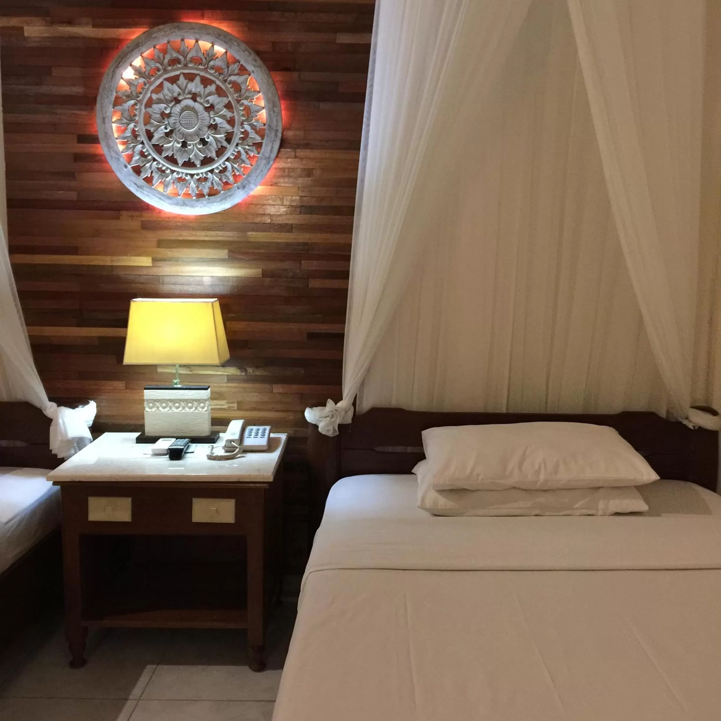 Bed in Bumi Ayu Bungalow Sanur
