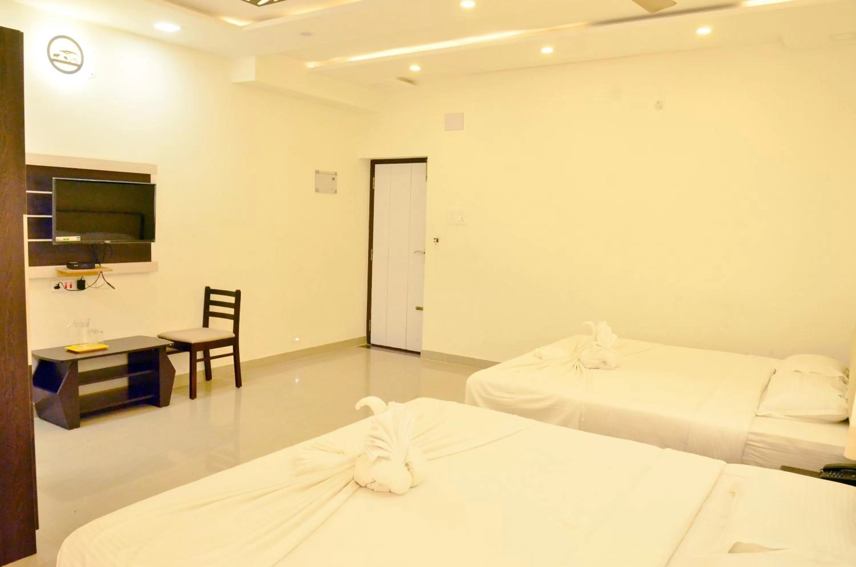 Bed in Hotel Ambai Grand