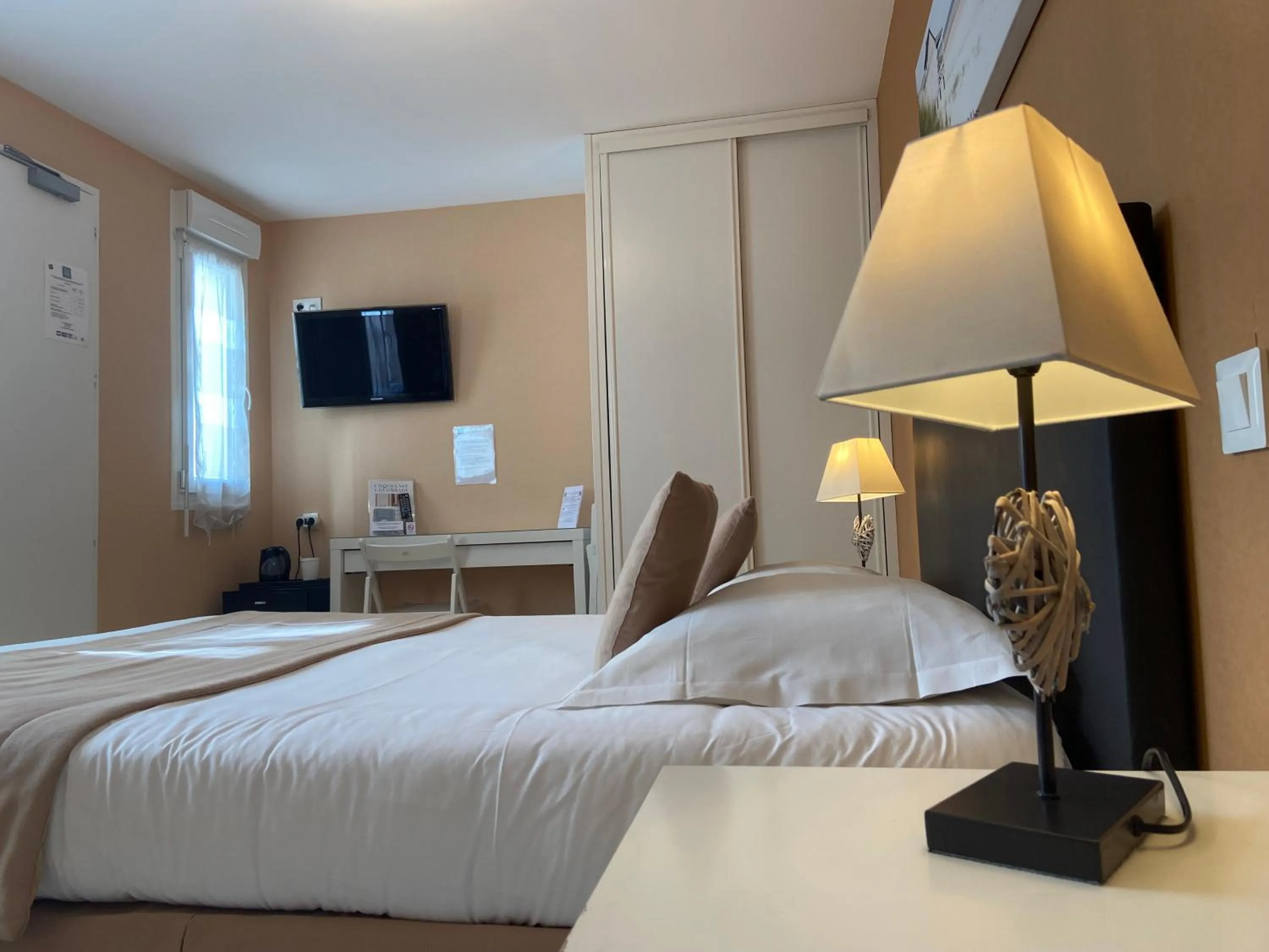 Photo of the whole room, Bed in Hôtel de la Plage