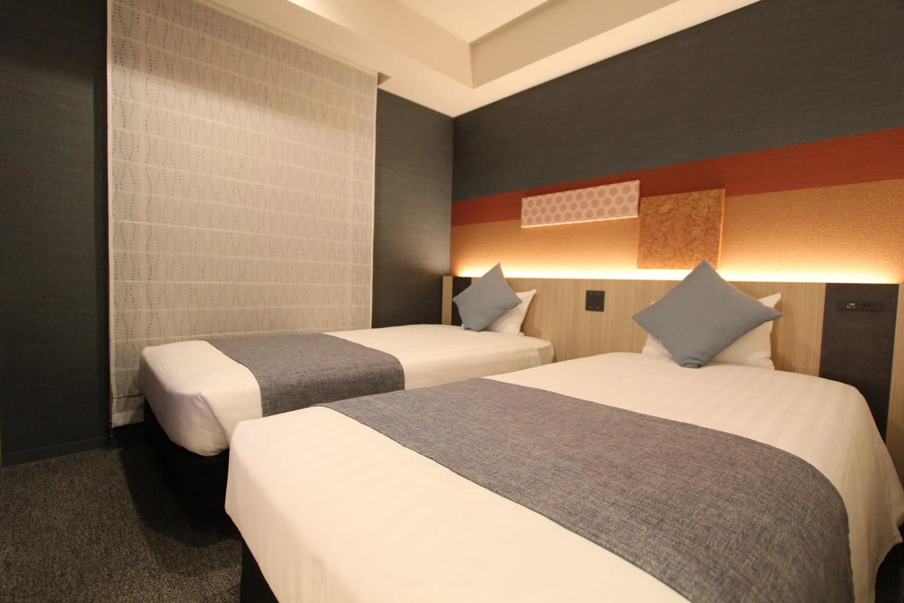 Bed in KOKO HOTEL Tsukiji Ginza