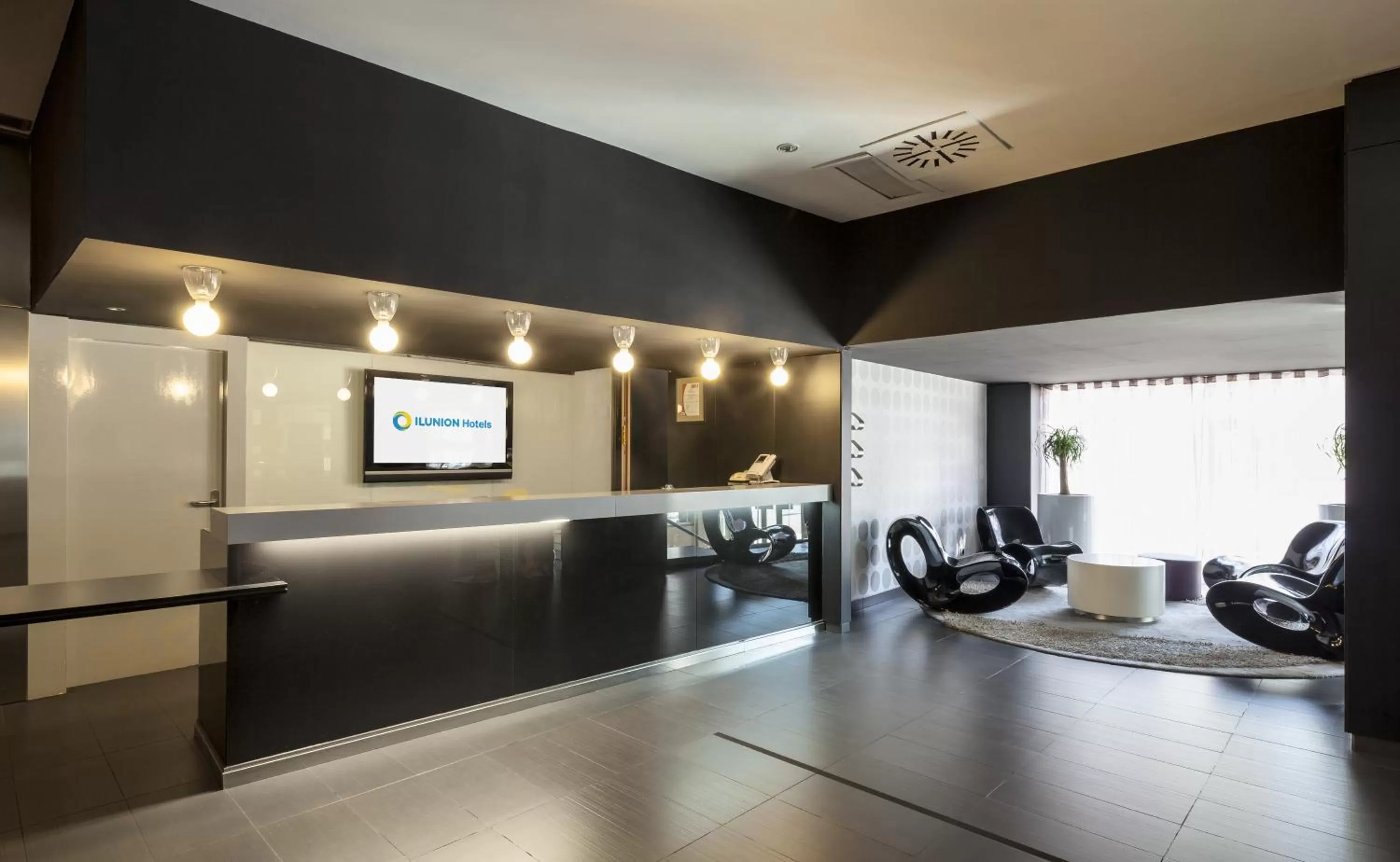 Communal lounge/ TV room in Ilunion Bel-Art