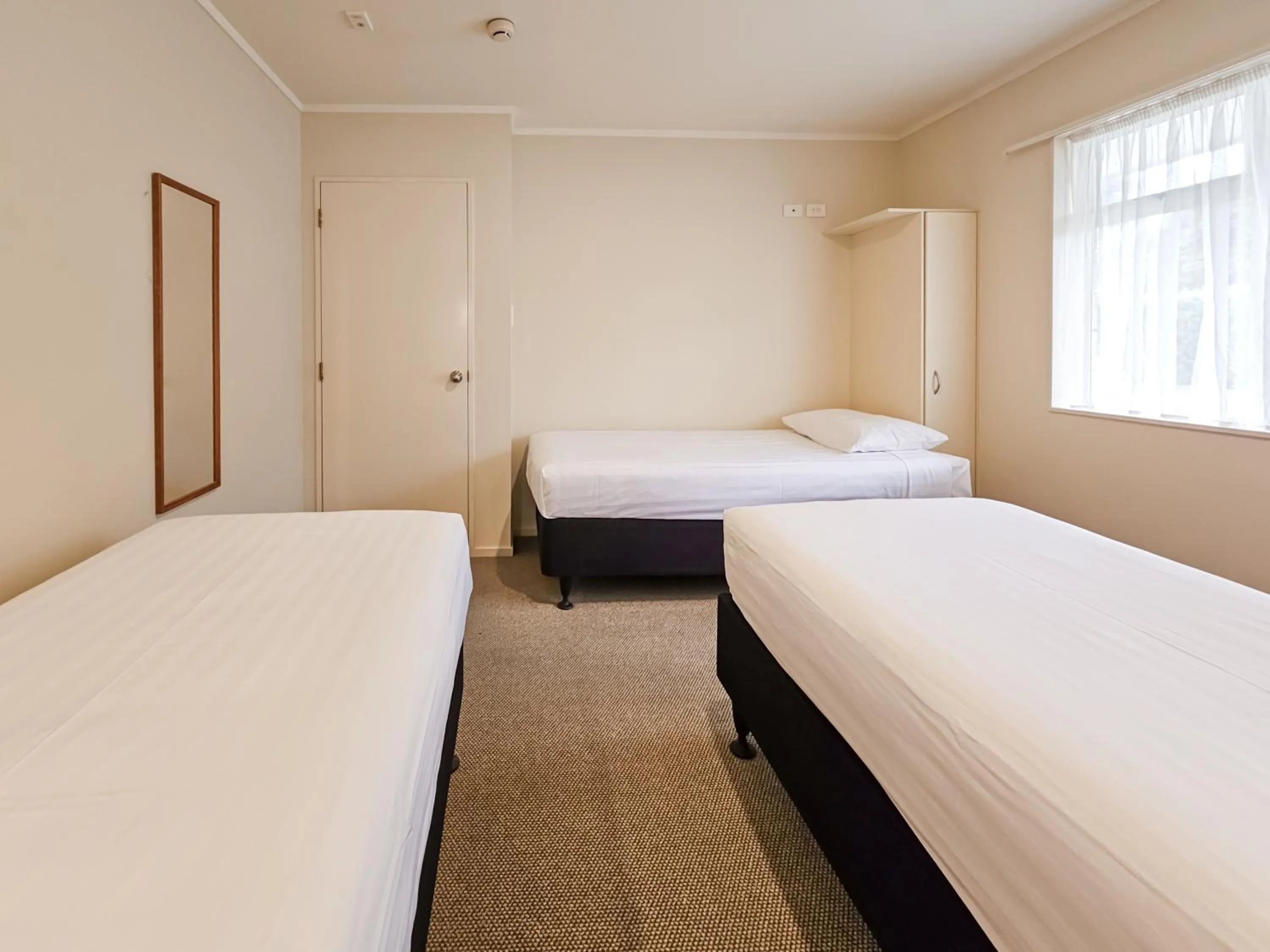 Bed in Captain Cook Motor Lodge