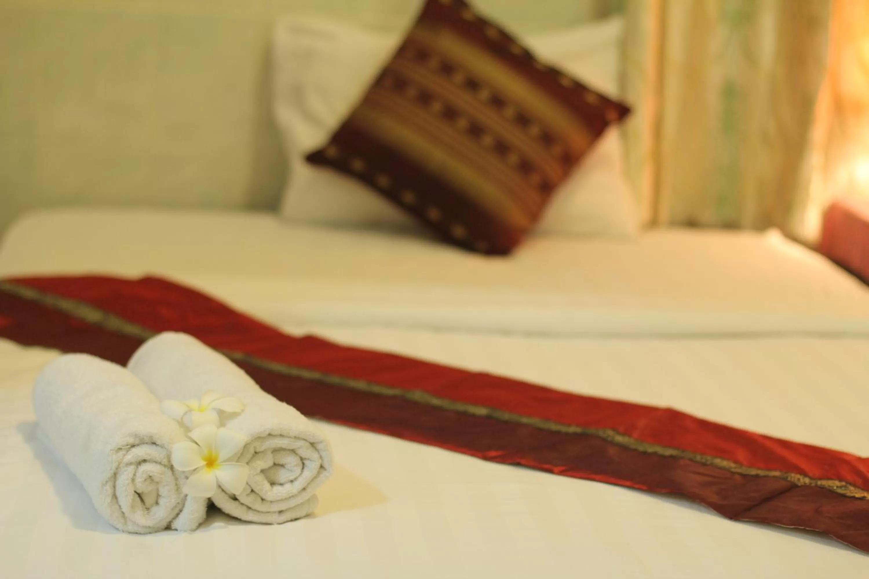 Bed in New Season Riverside Hotel