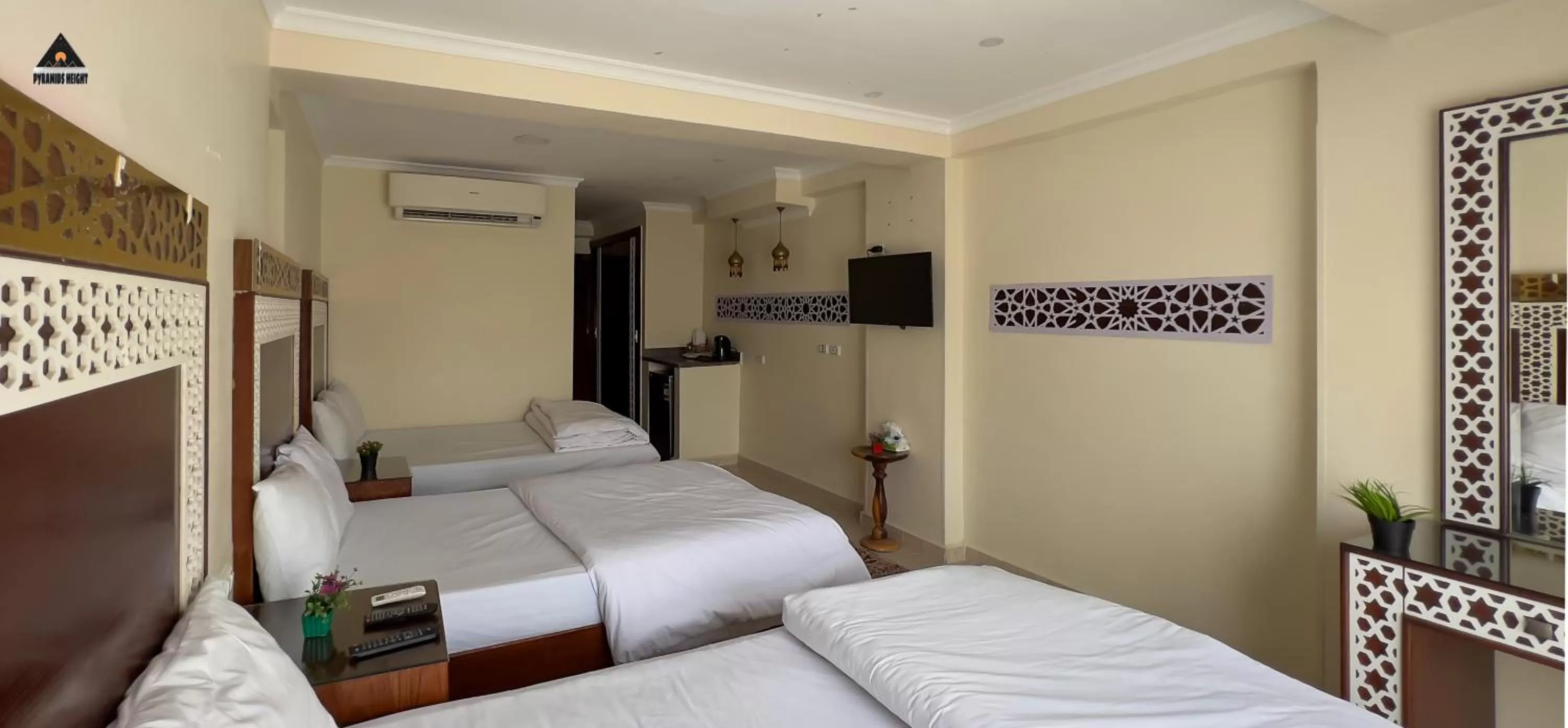 Bed in Pyramids Height Hotel & Pyramids Master Scene Rooftop