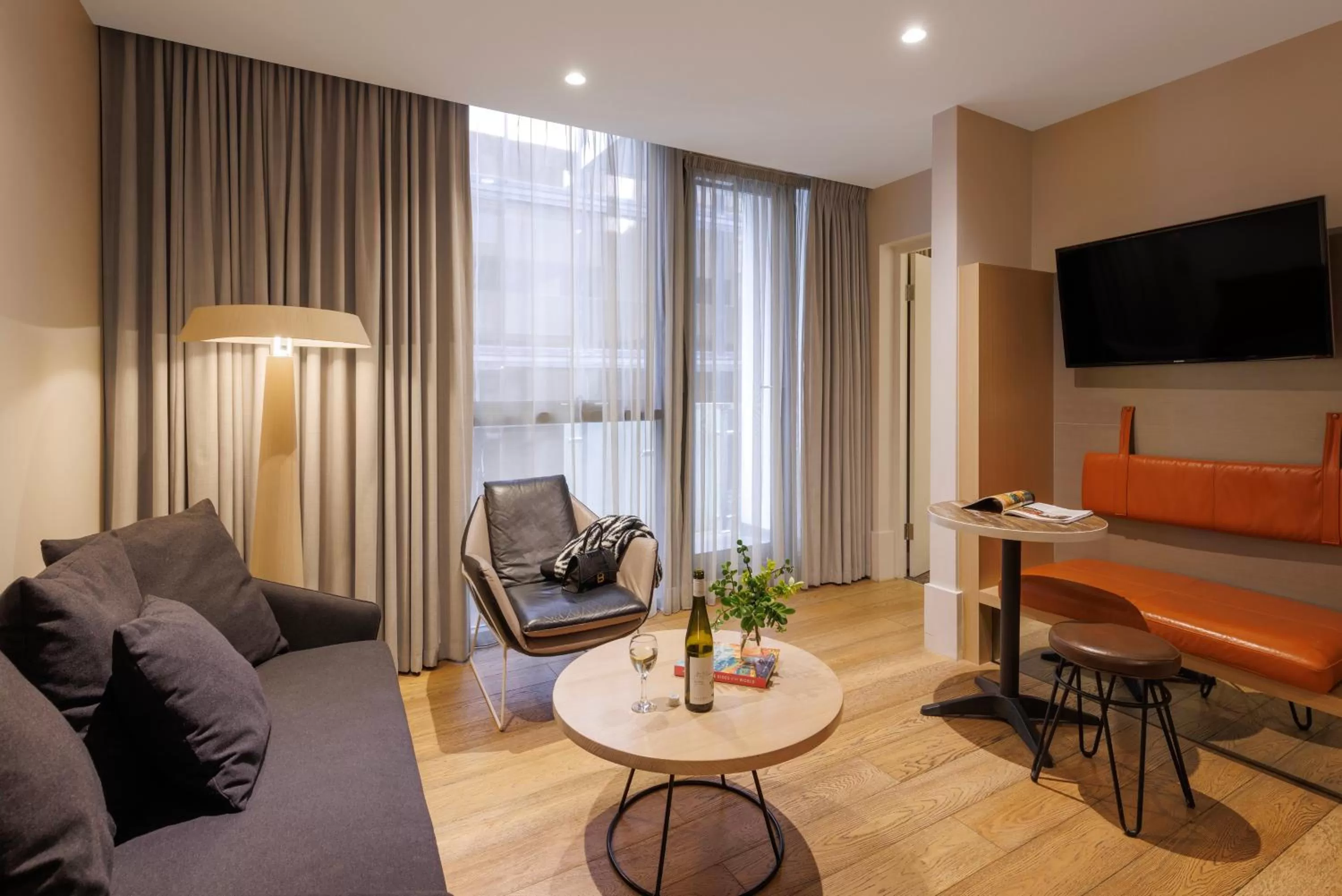 Communal lounge/ TV room in Brady Hotels Central Melbourne