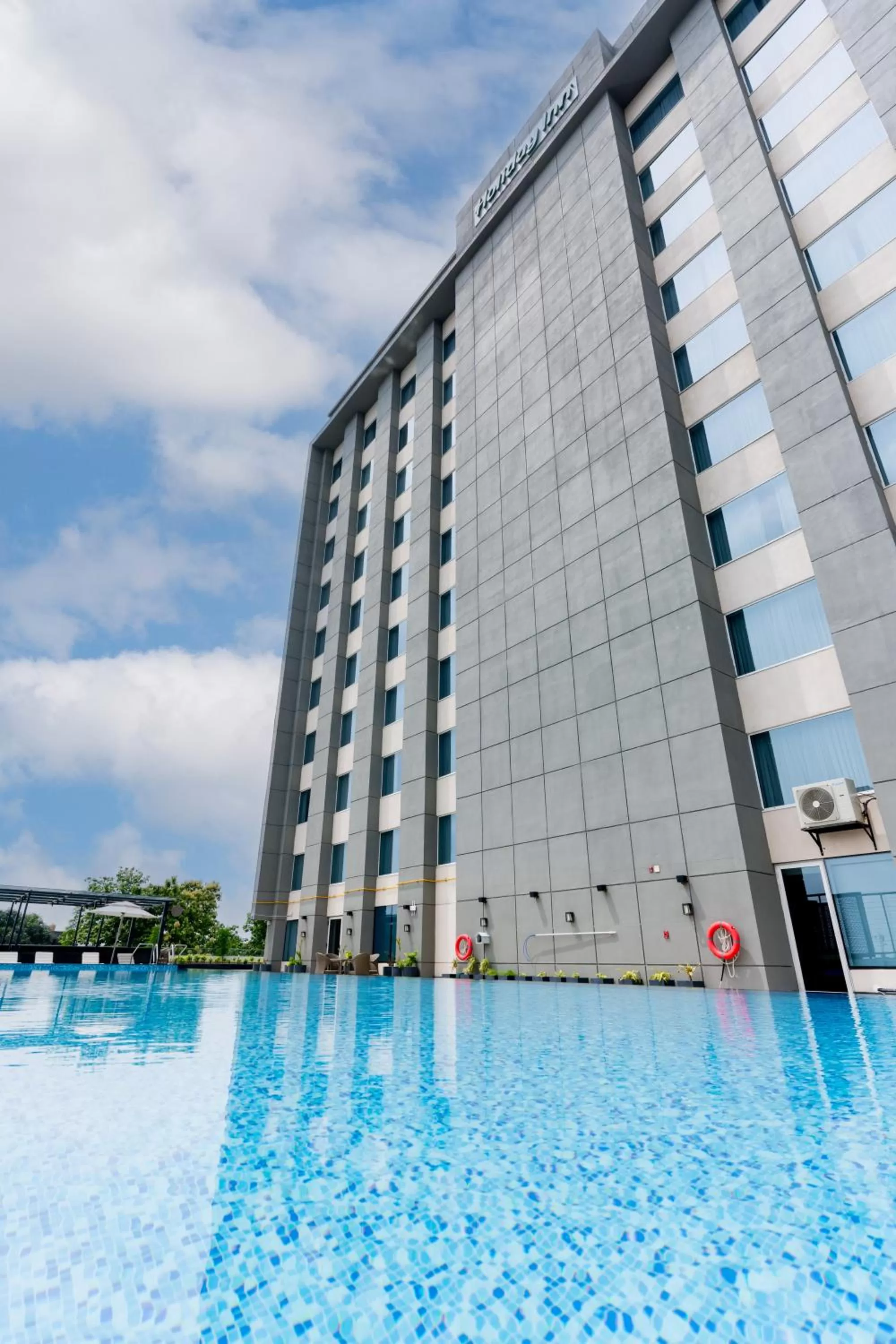 Swimming pool in Holiday Inn Lucknow Airport by IHG