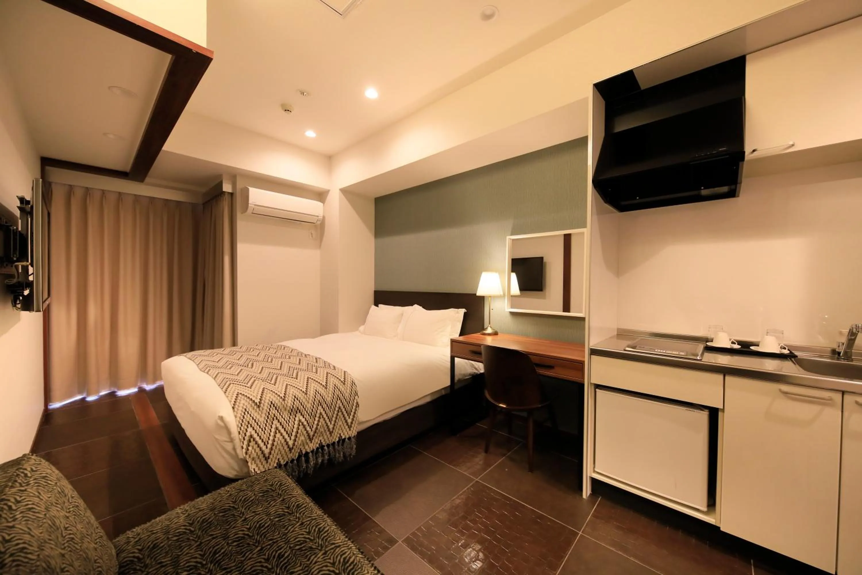 Photo of the whole room, Bed in Centurion Hotel Residential Akasaka Station