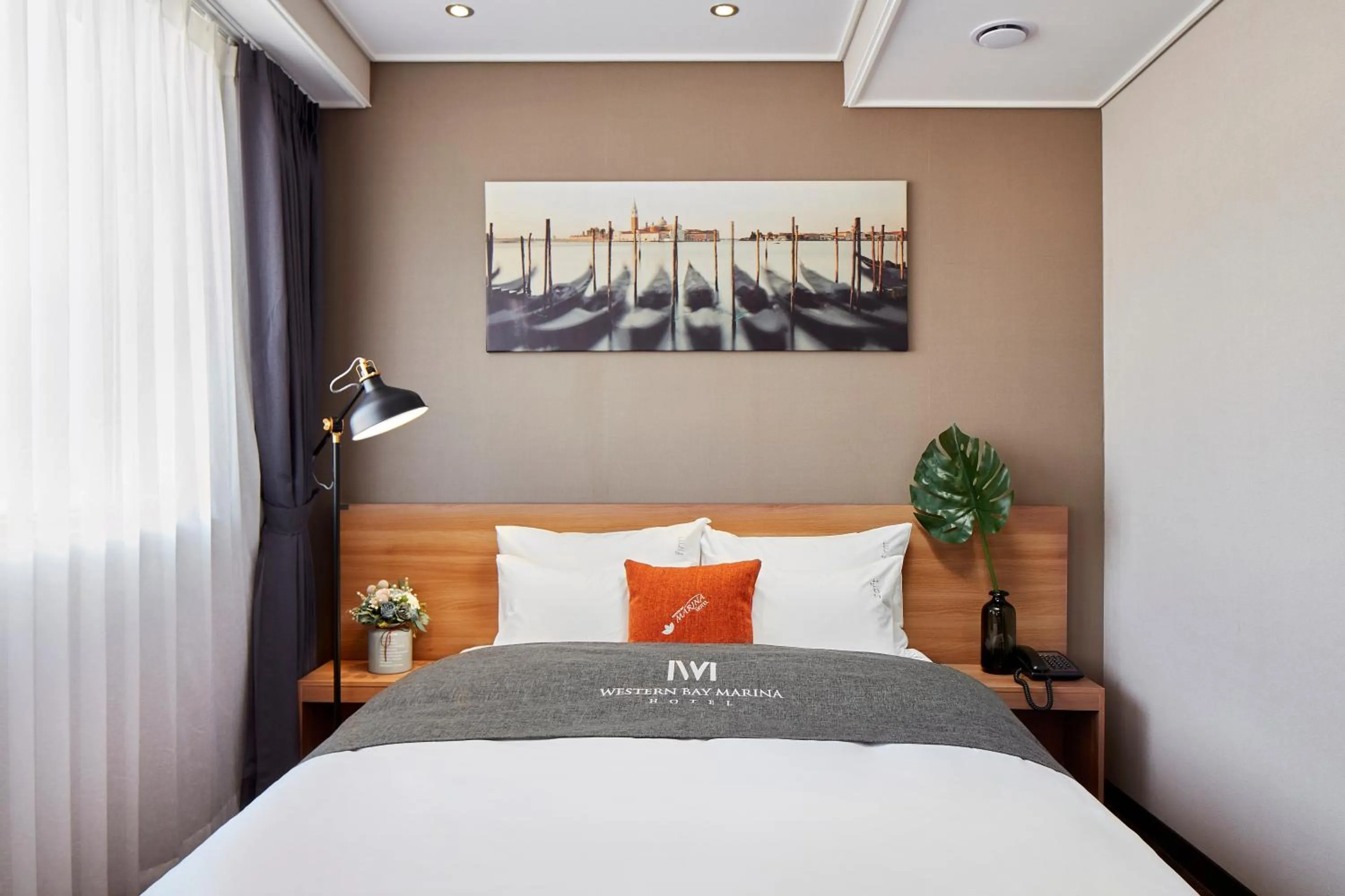 Bed in Western Bay Marina Hotel