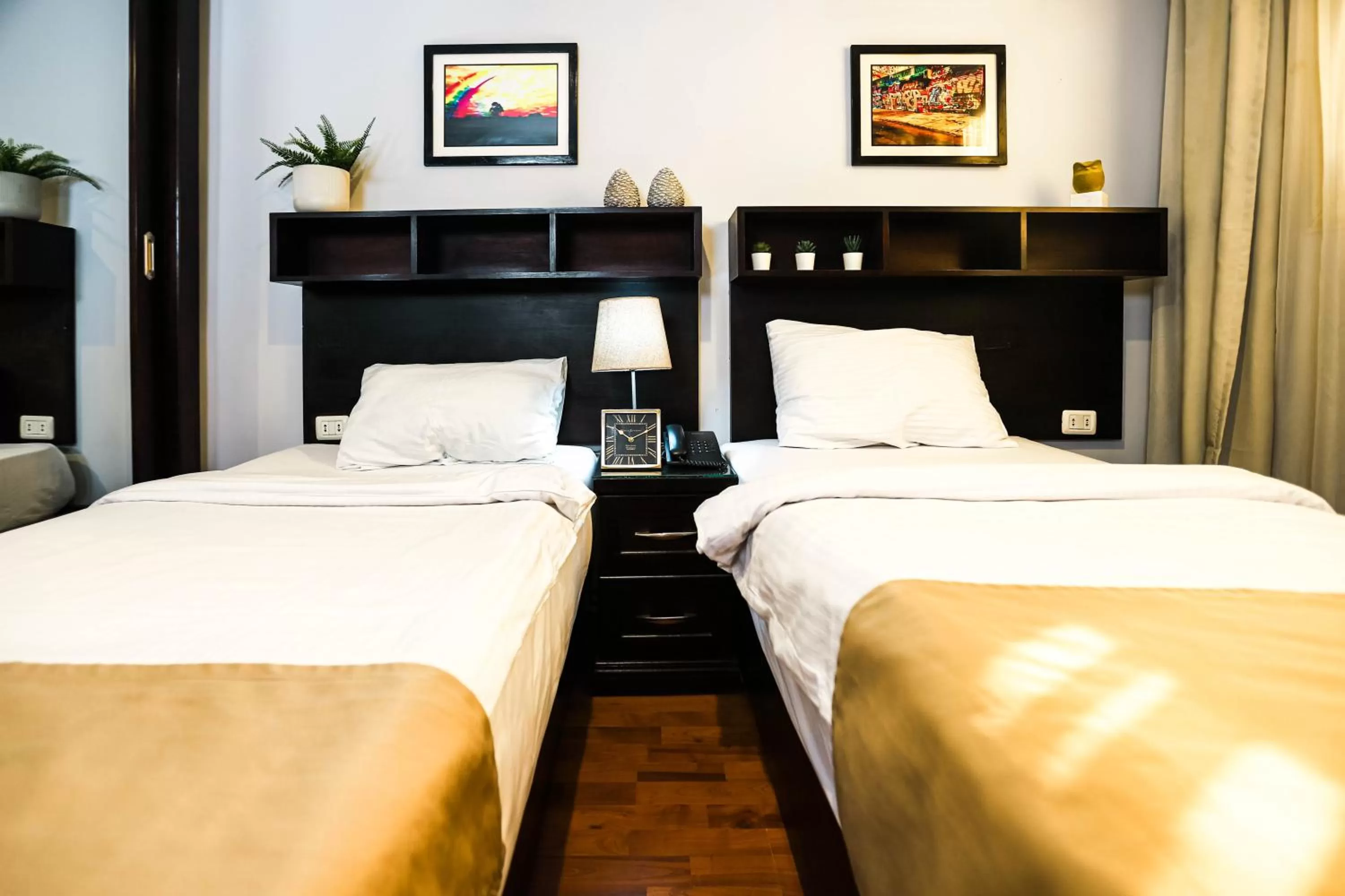 Bed in NewCity Hotel & Suites