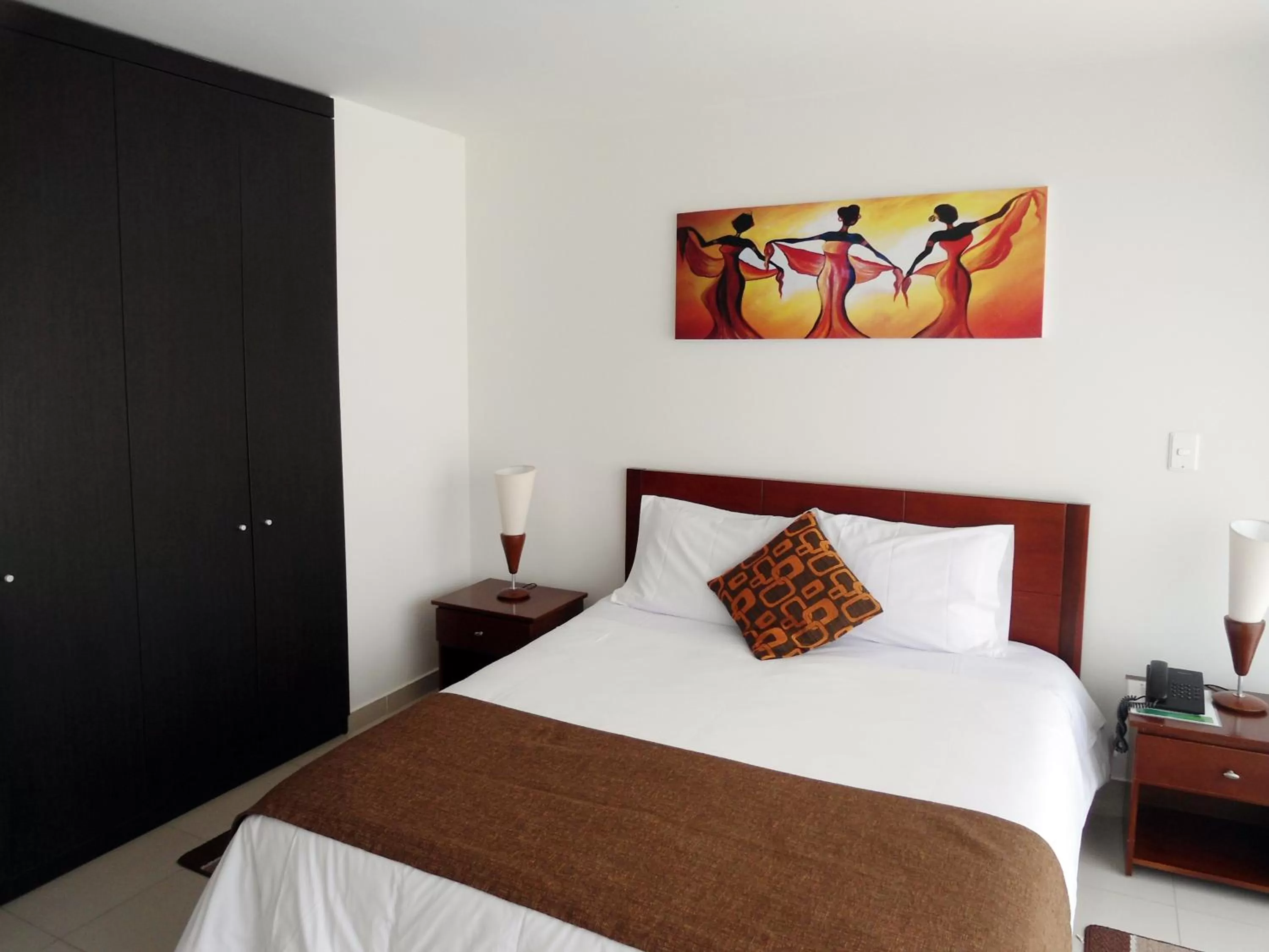 Bed in 122 Plaza Apartahotel