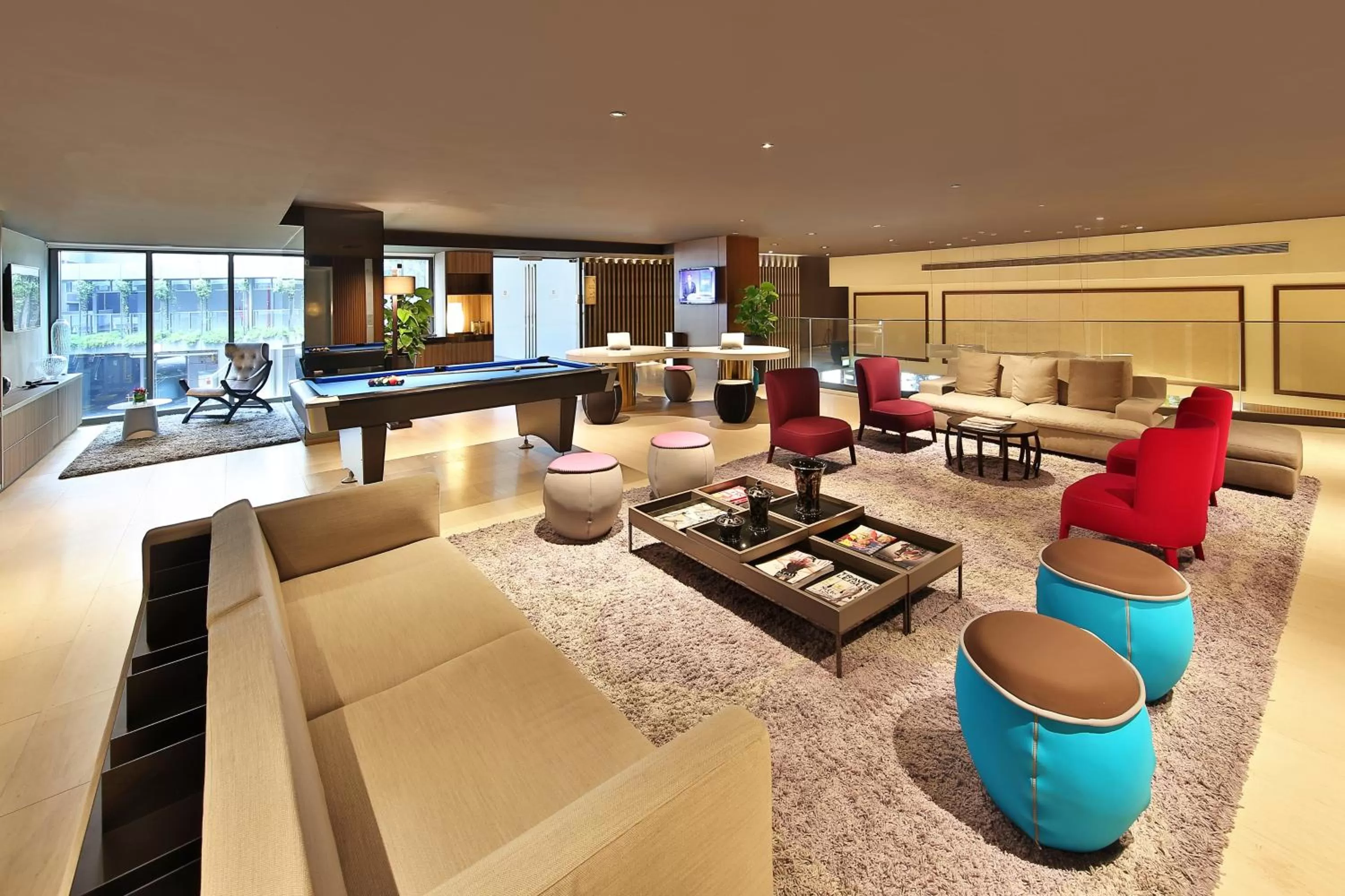 Communal lounge/ TV room in Pan Pacific Serviced Suites Beach Road, Singapore