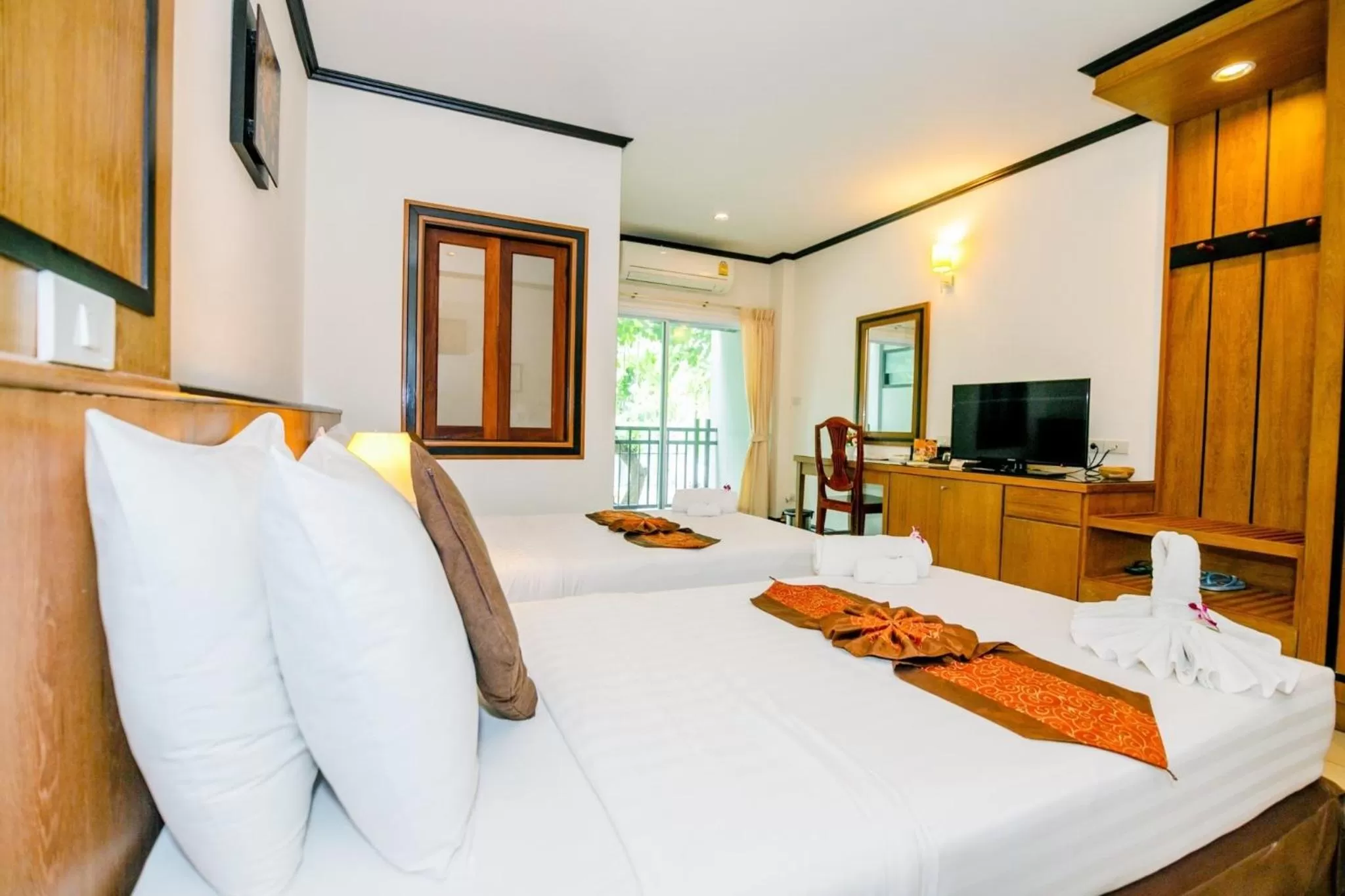 Bed in Rapeepan Ville Hotel