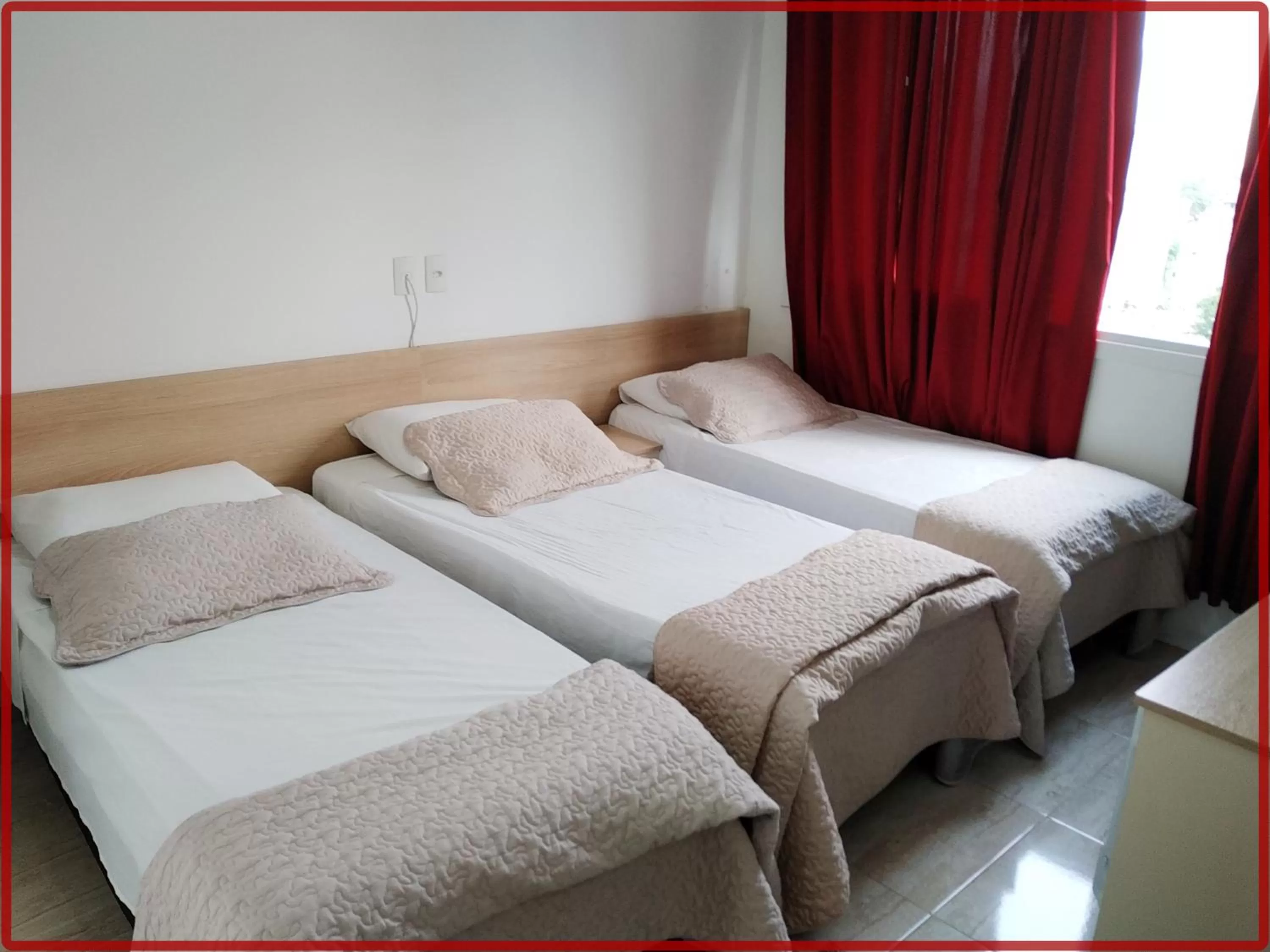 Bed in Hotel Anjos LTDA