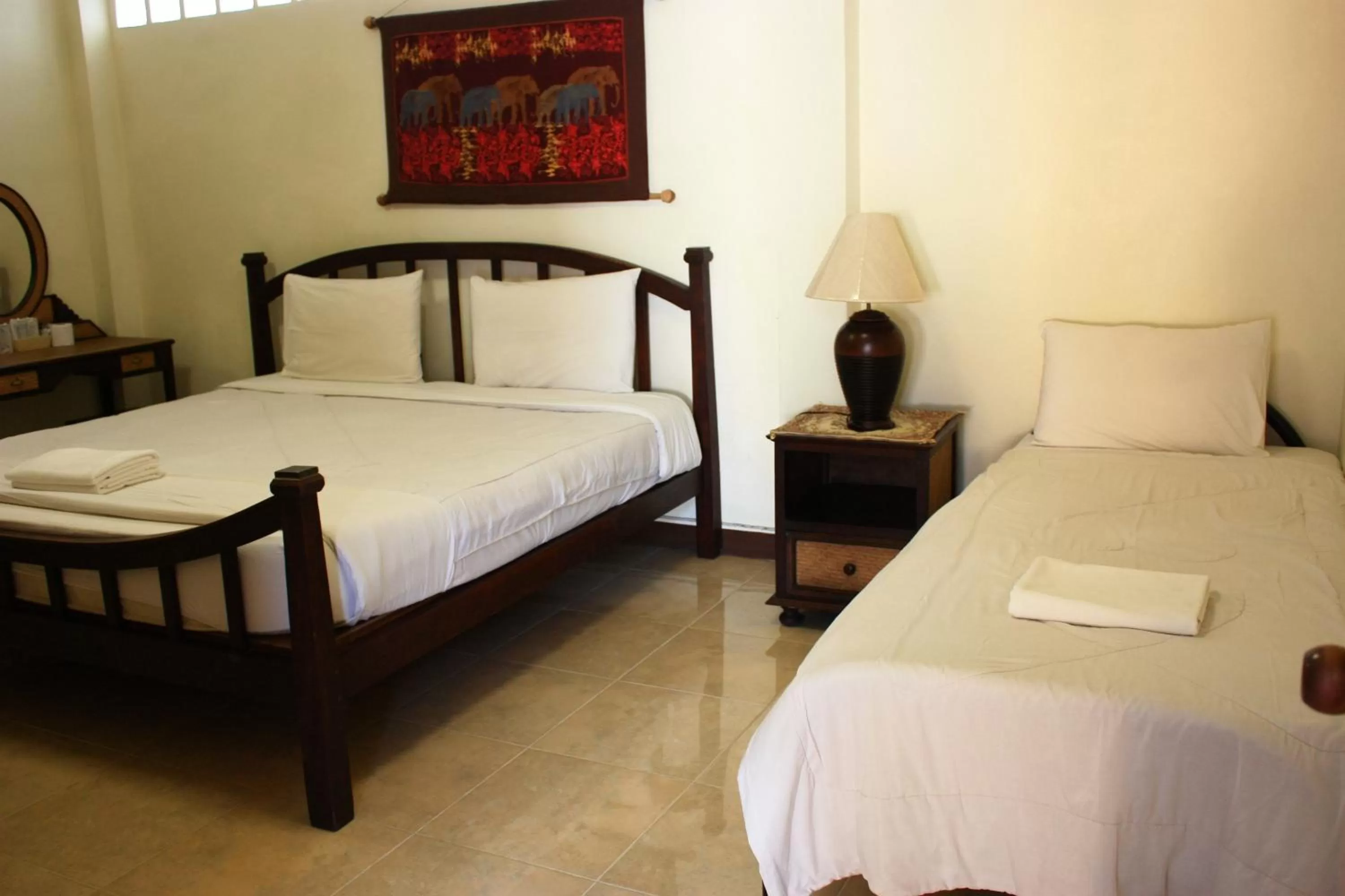 Bed in โรงแรมตีฆ้อง - Tri Gong Hotel