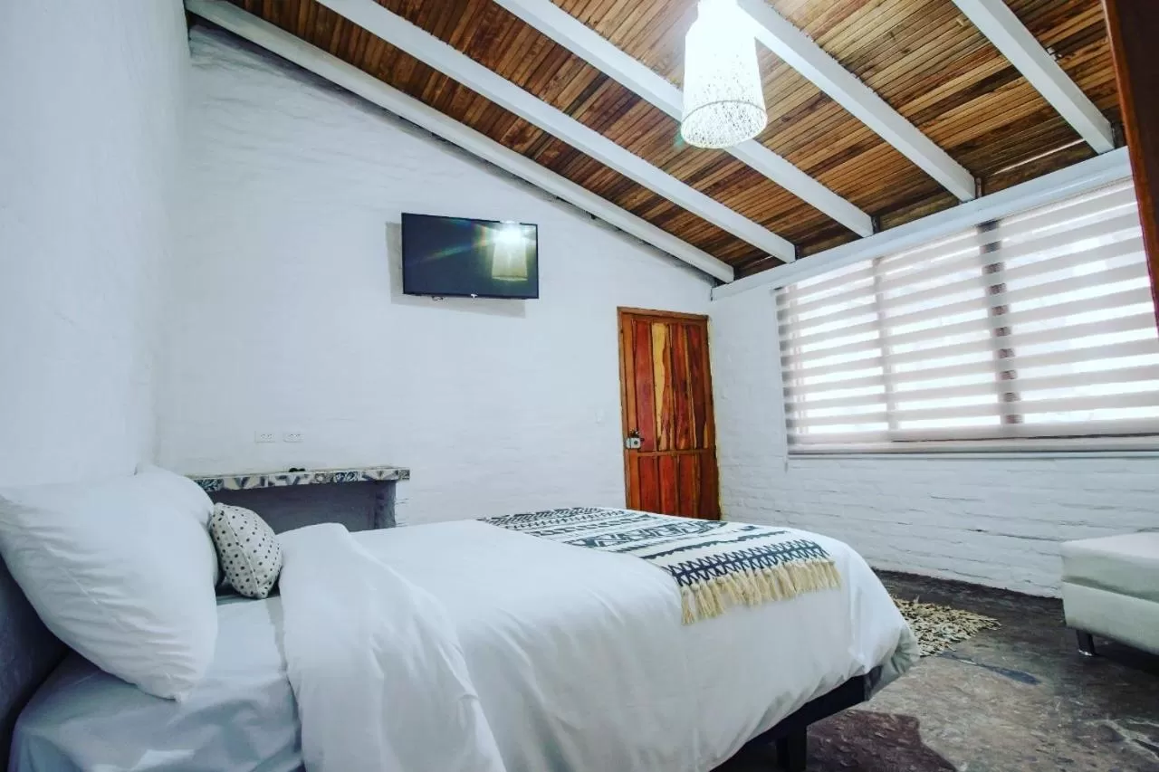 Bed in Rústic Hotel Quinta La Aurora