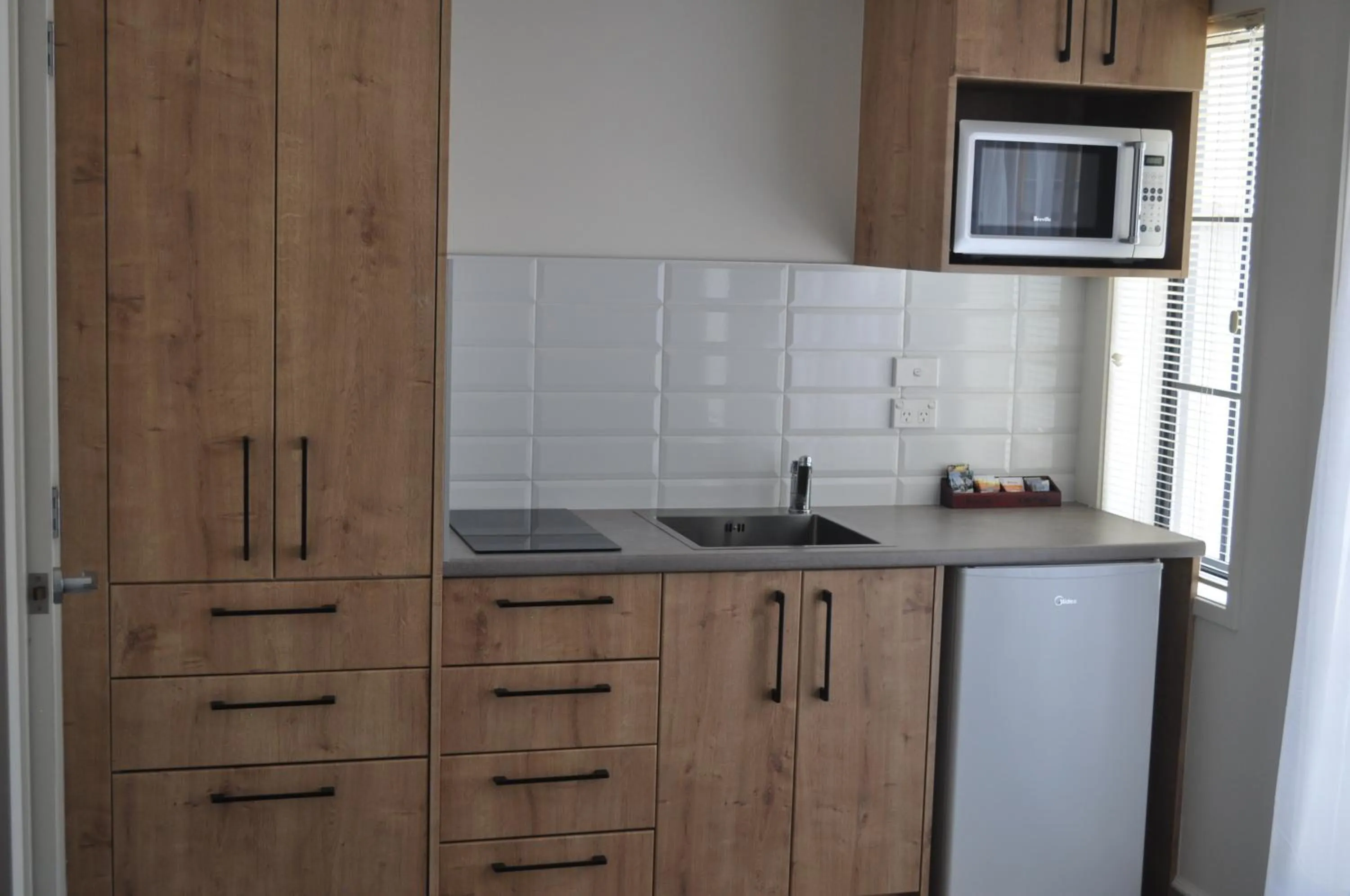Kitchen or kitchenette in City Suites