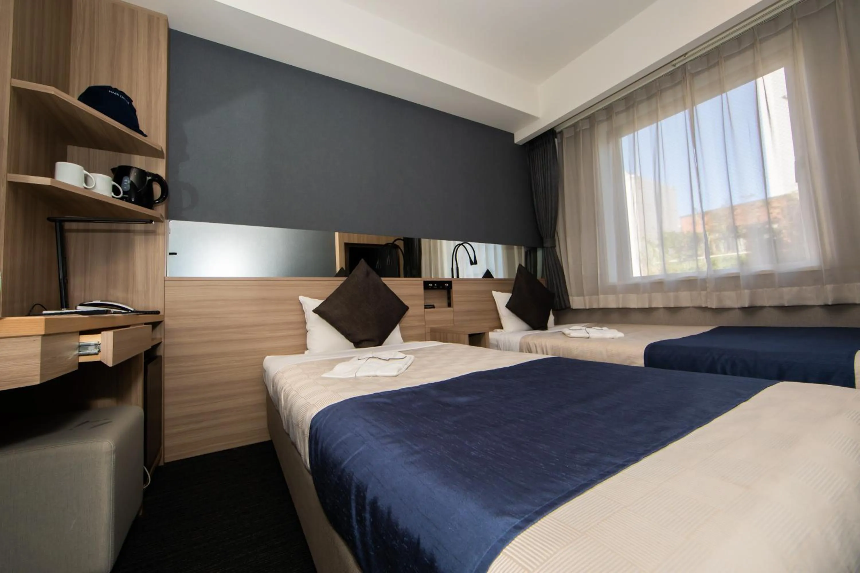 Photo of the whole room, Bed in Quintessa Hotel Osaka Shinsaibashi Comic & Books