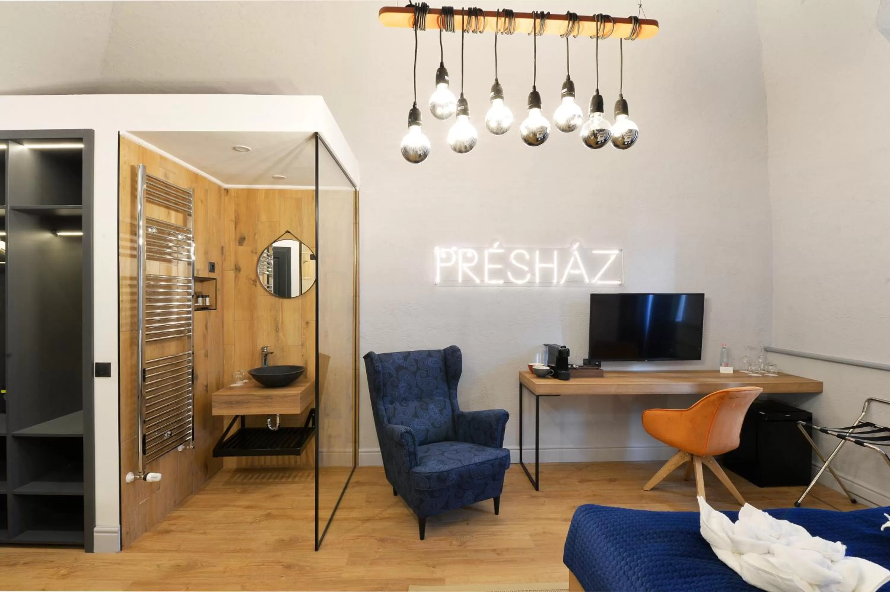 Photo of the whole room, TV/Entertainment Center in 1552 Boutique Hotel