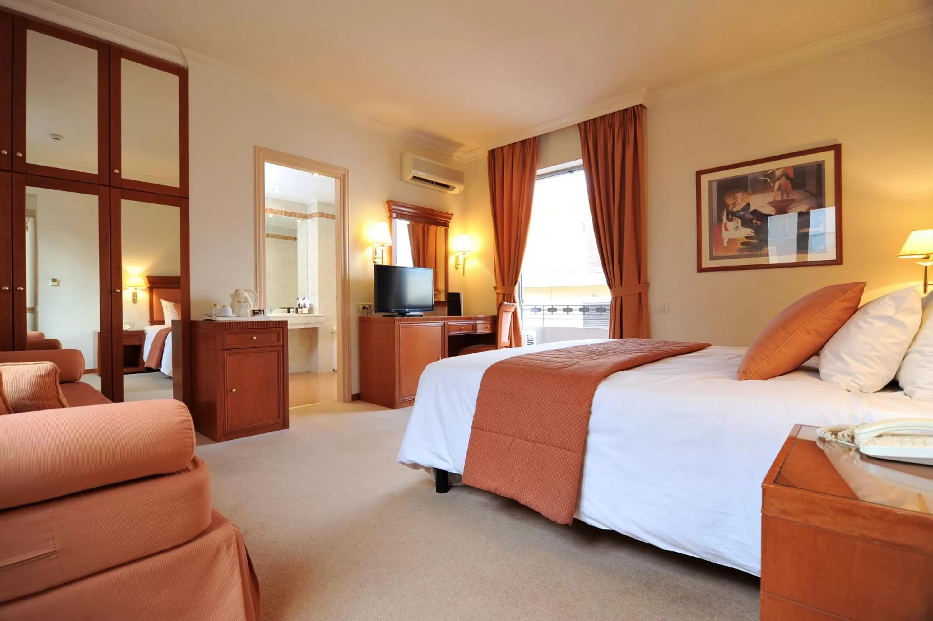 Photo of the whole room, Bed in Athens Atrium Hotel & Jacuzzi Suites