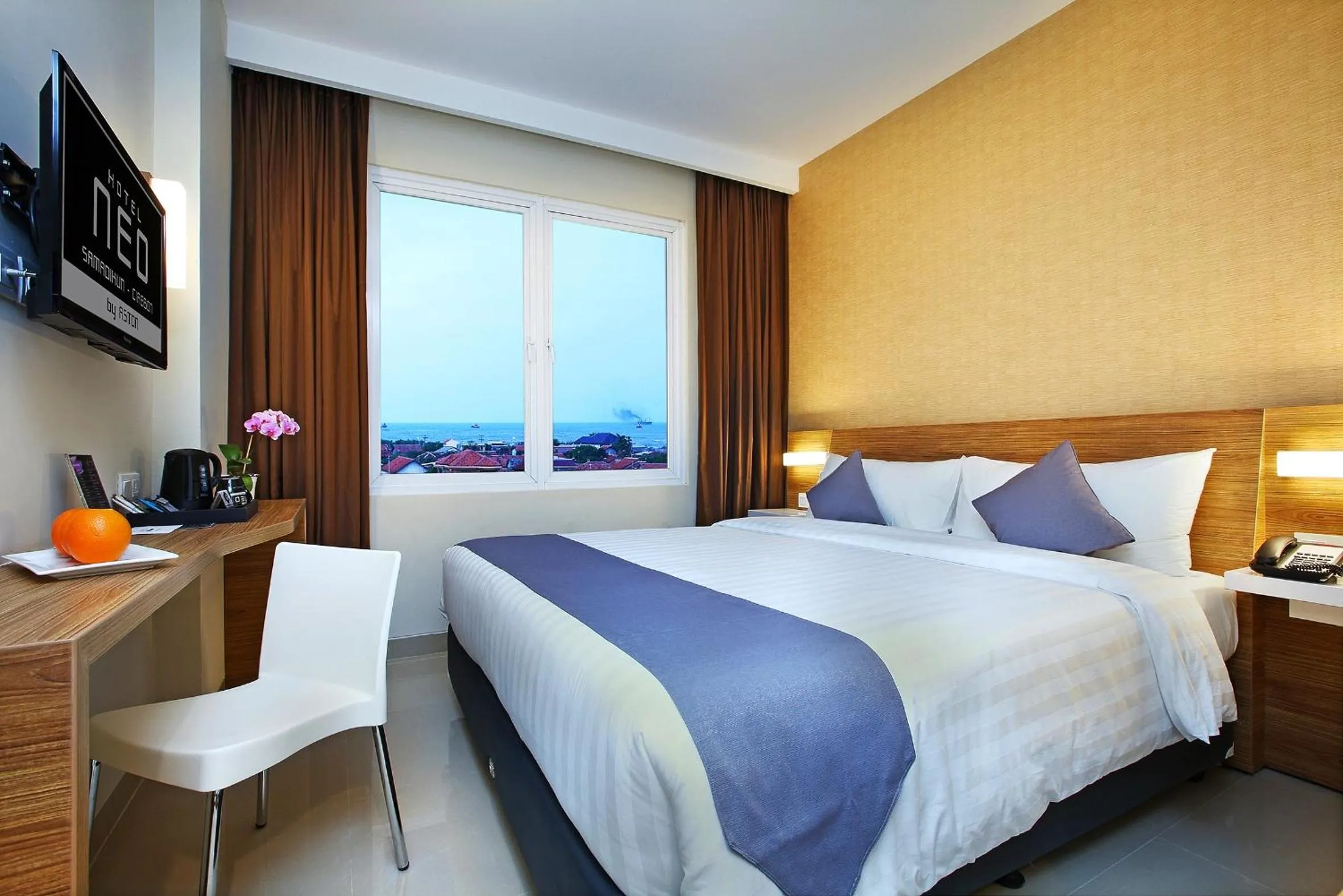 Photo of the whole room, Bed in Hotel NEO Cirebon by ASTON