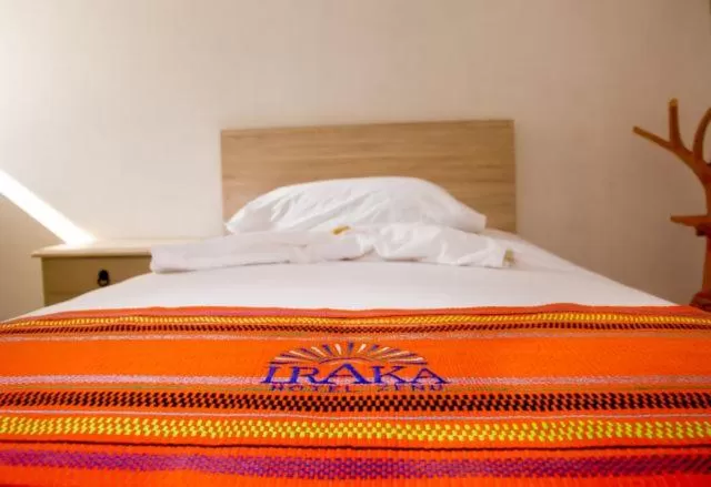 Bed in Hotel Iraka Zenu