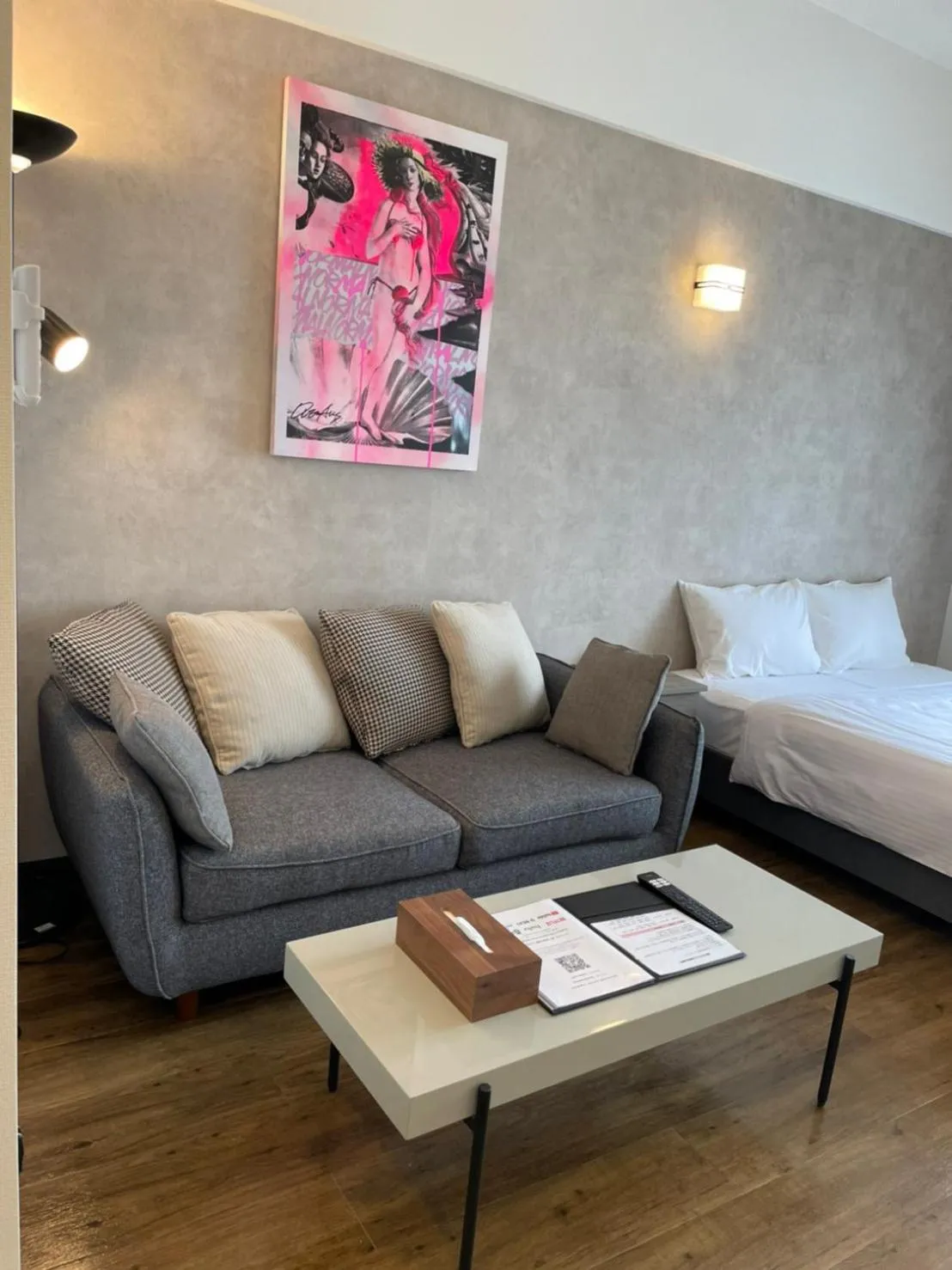 Photo of the whole room, Bed in New Normal Hotel in NAMINOUE ニューノーマルホテルイン波の上