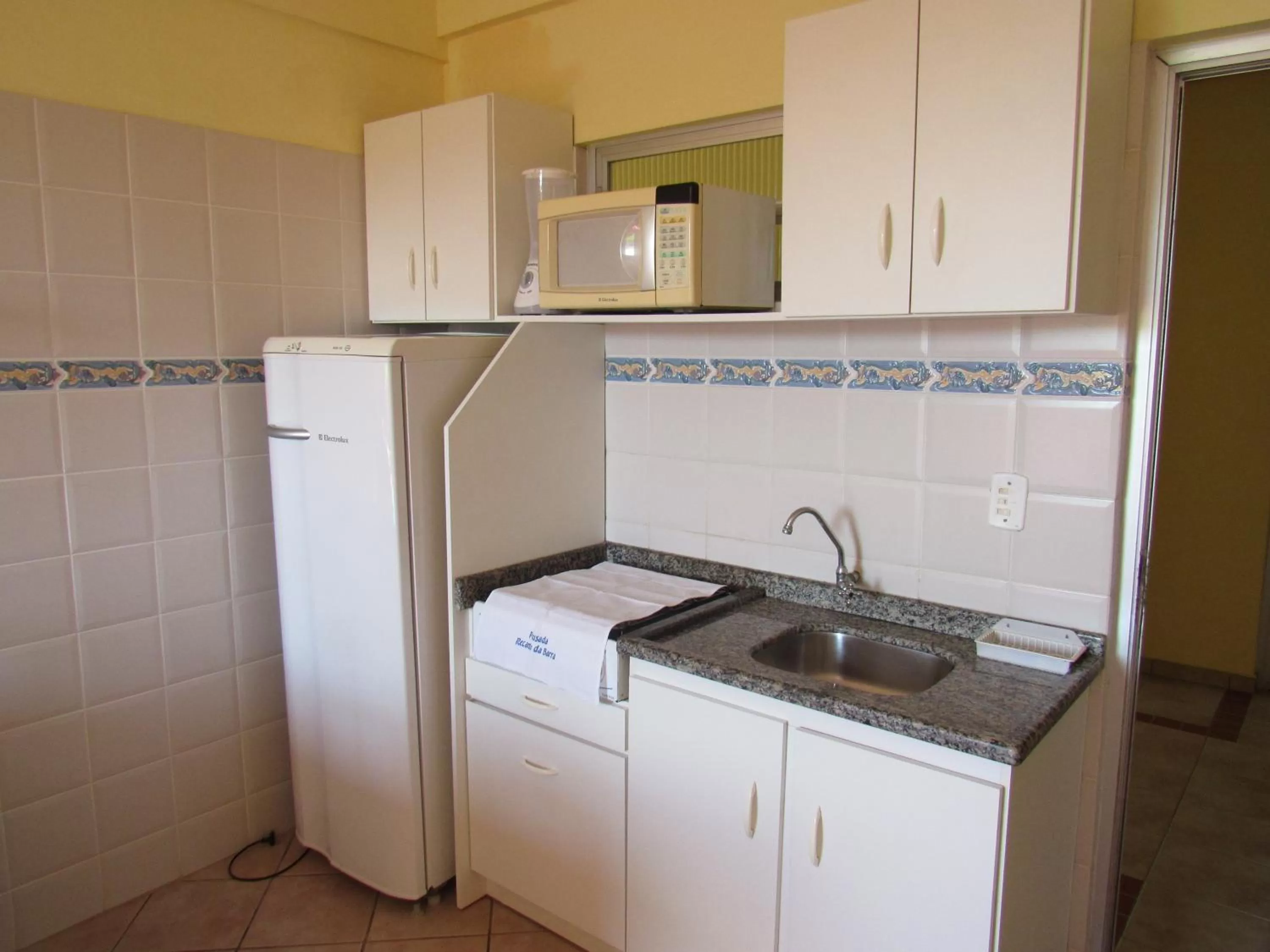 Kitchen or kitchenette in Pousada Recanto da Barra