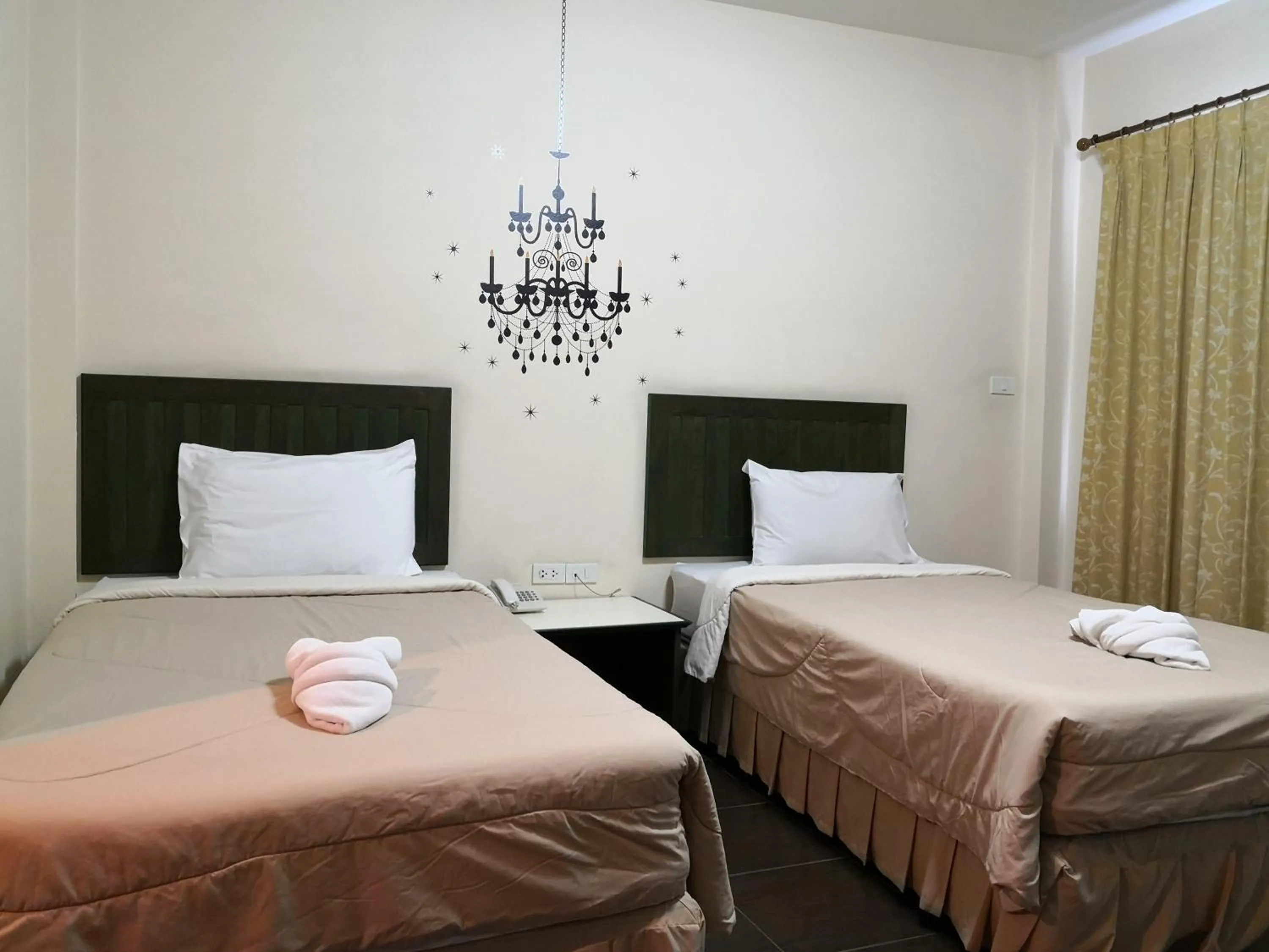 Bed in Baan Suksiri Hotel