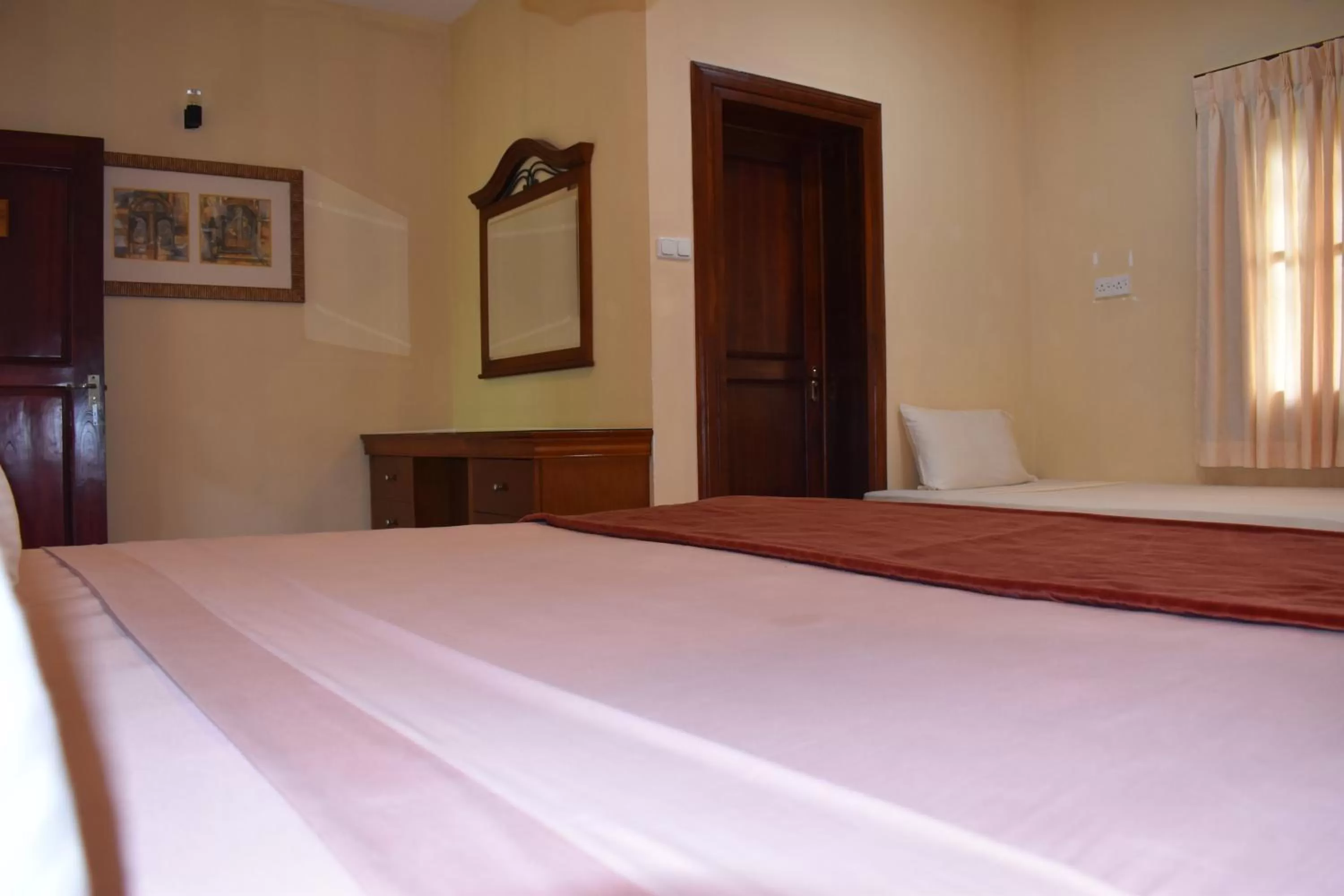 Bed in Hotel 4 U Saliya Garden
