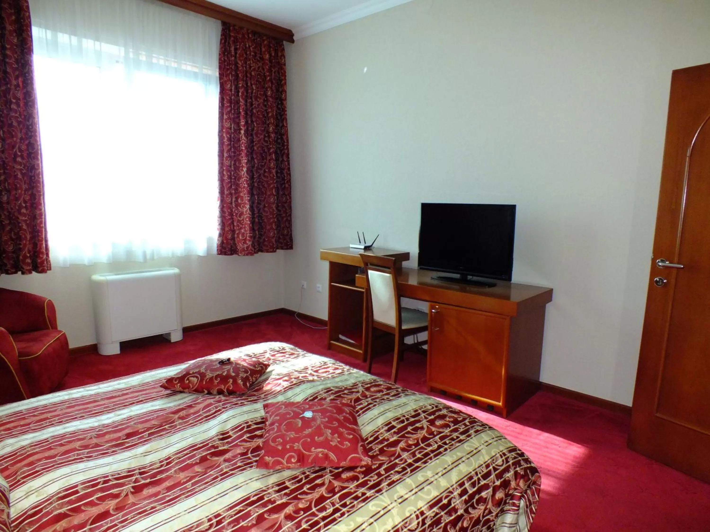 Bed, TV/Entertainment Center in Hotel Vidović